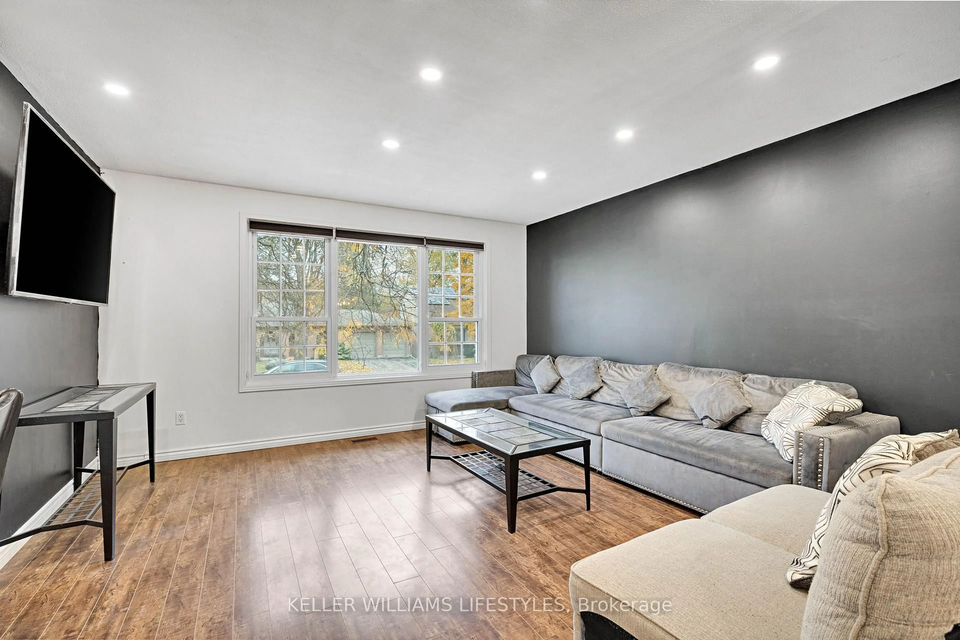 Living room with furniture, wood/laminate floor for 575 Grand View Ave, London South Ontario N6K 3E9