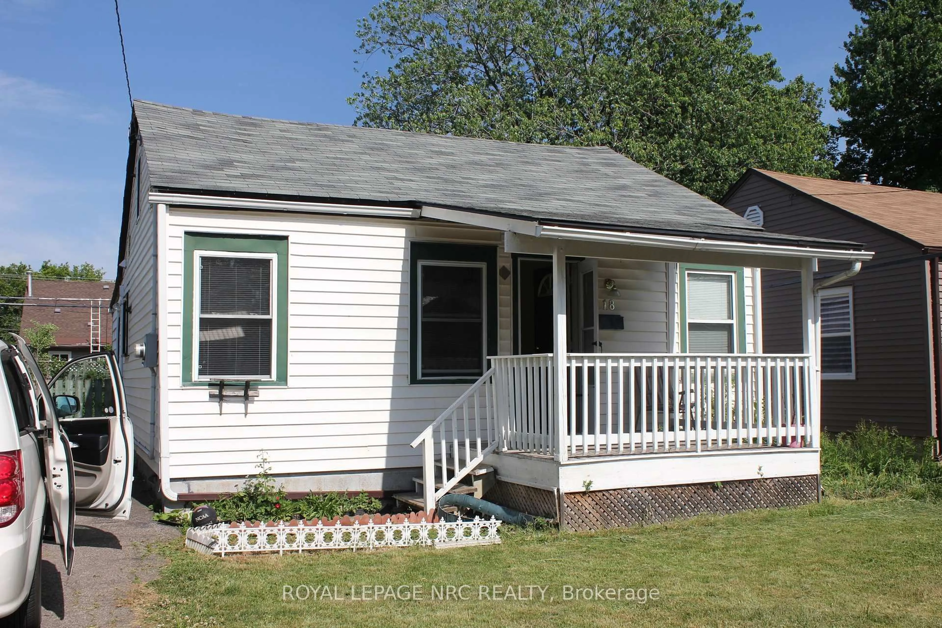 Home with vinyl exterior material, street for 18 Cosby Ave, St. Catharines Ontario L2M 5R4