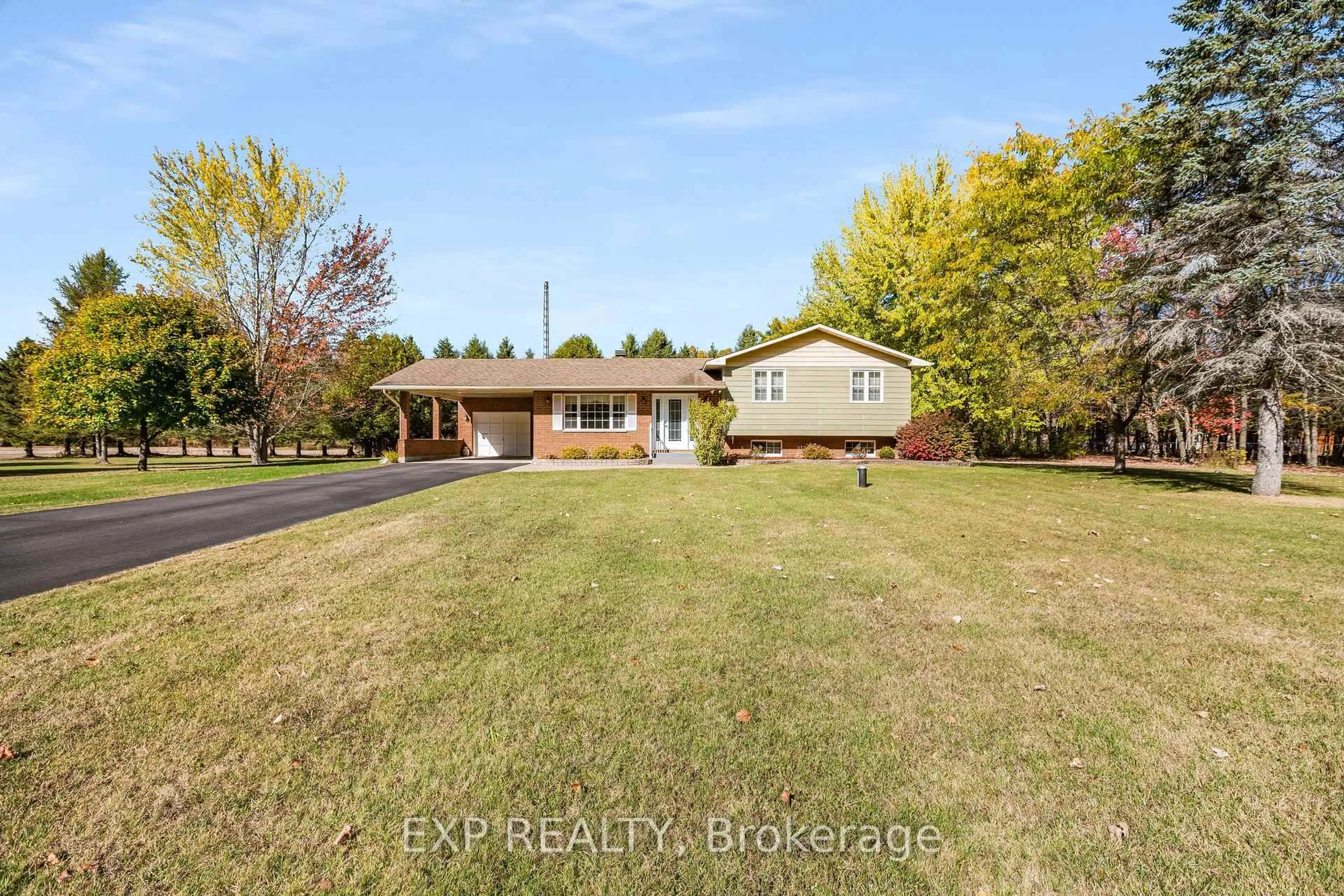 A pic from outside/outdoor area/front of a property/back of a property/a pic from drone, unknown for 384 Route 200 Rd, Casselman Ontario K0A 1M0