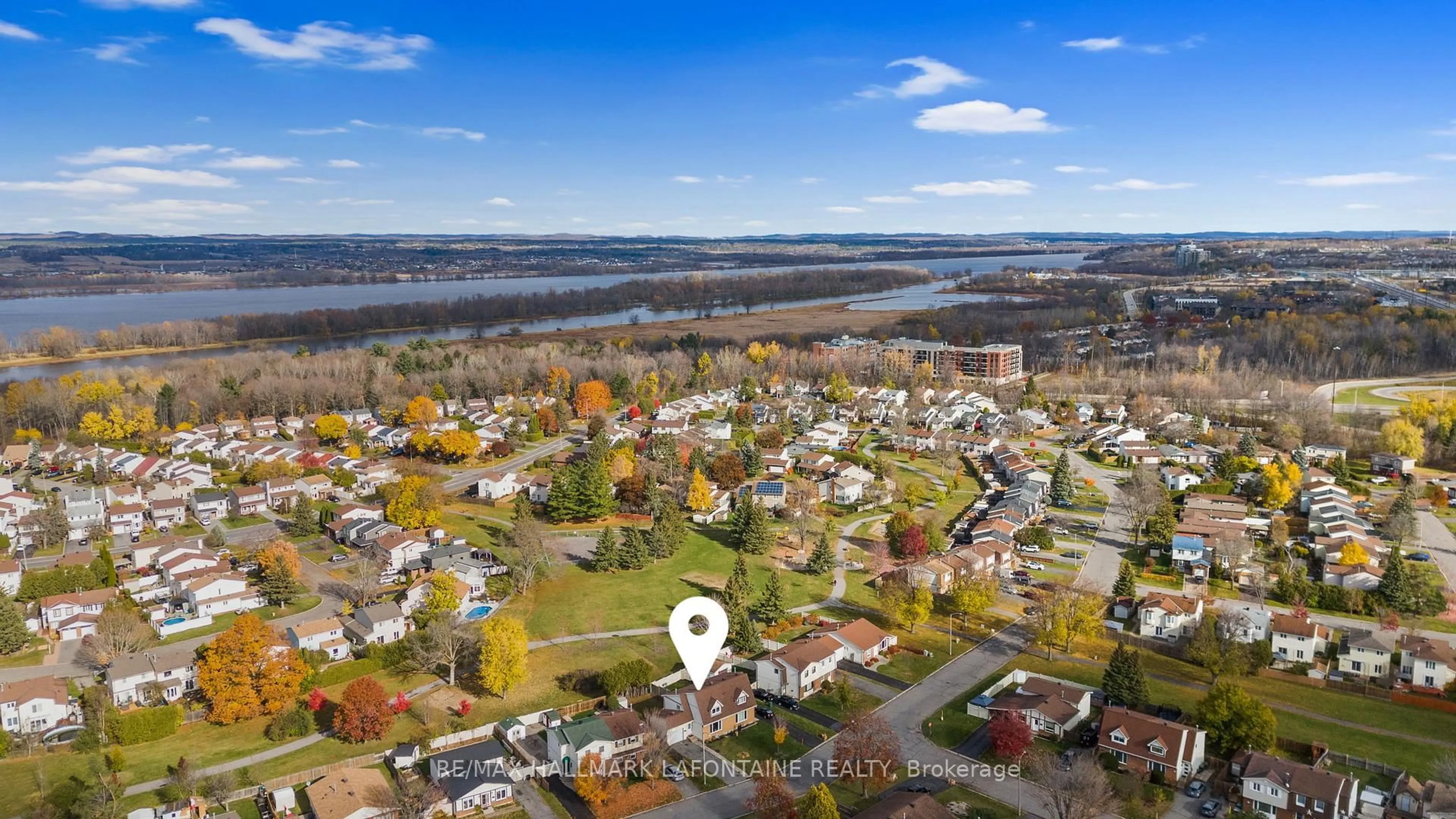 A pic from outside/outdoor area/front of a property/back of a property/a pic from drone, water/lake/river/ocean view for 303 Mockingbird Dr, Ottawa Ontario K1E 2A4