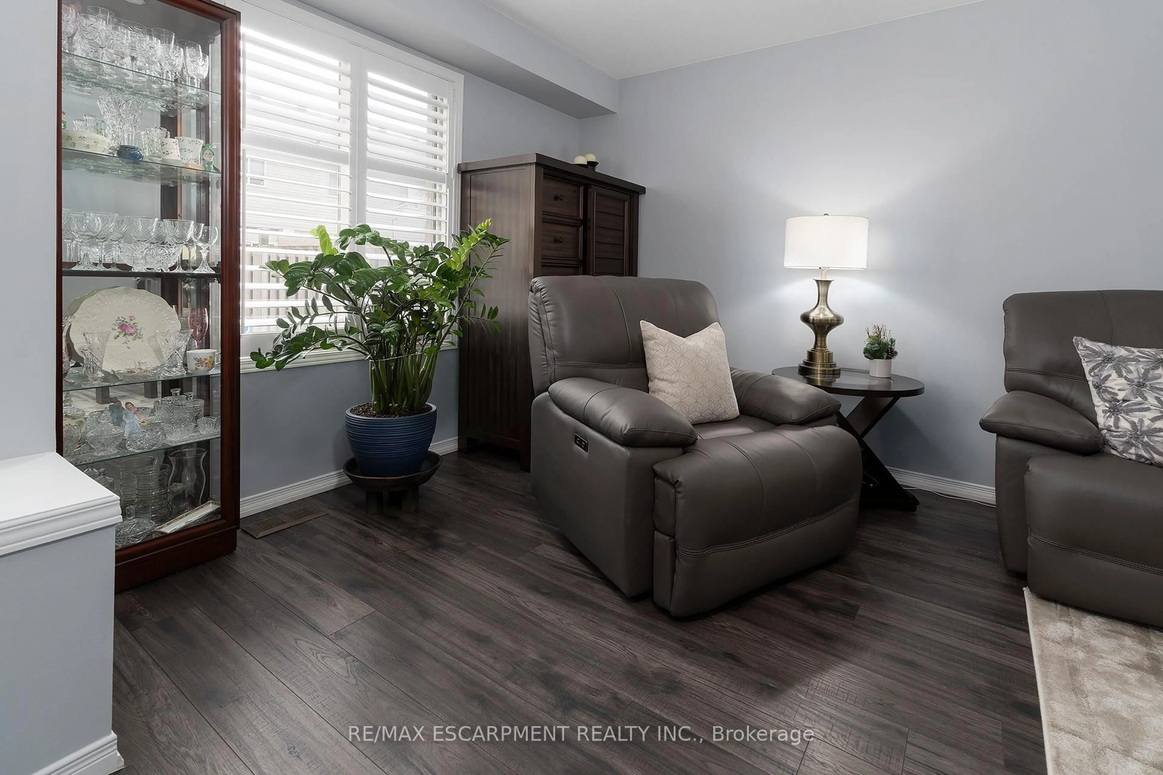 Living room with furniture, wood/laminate floor for 1523 Upper Gage Ave #10, Hamilton Ontario L8W 1E6