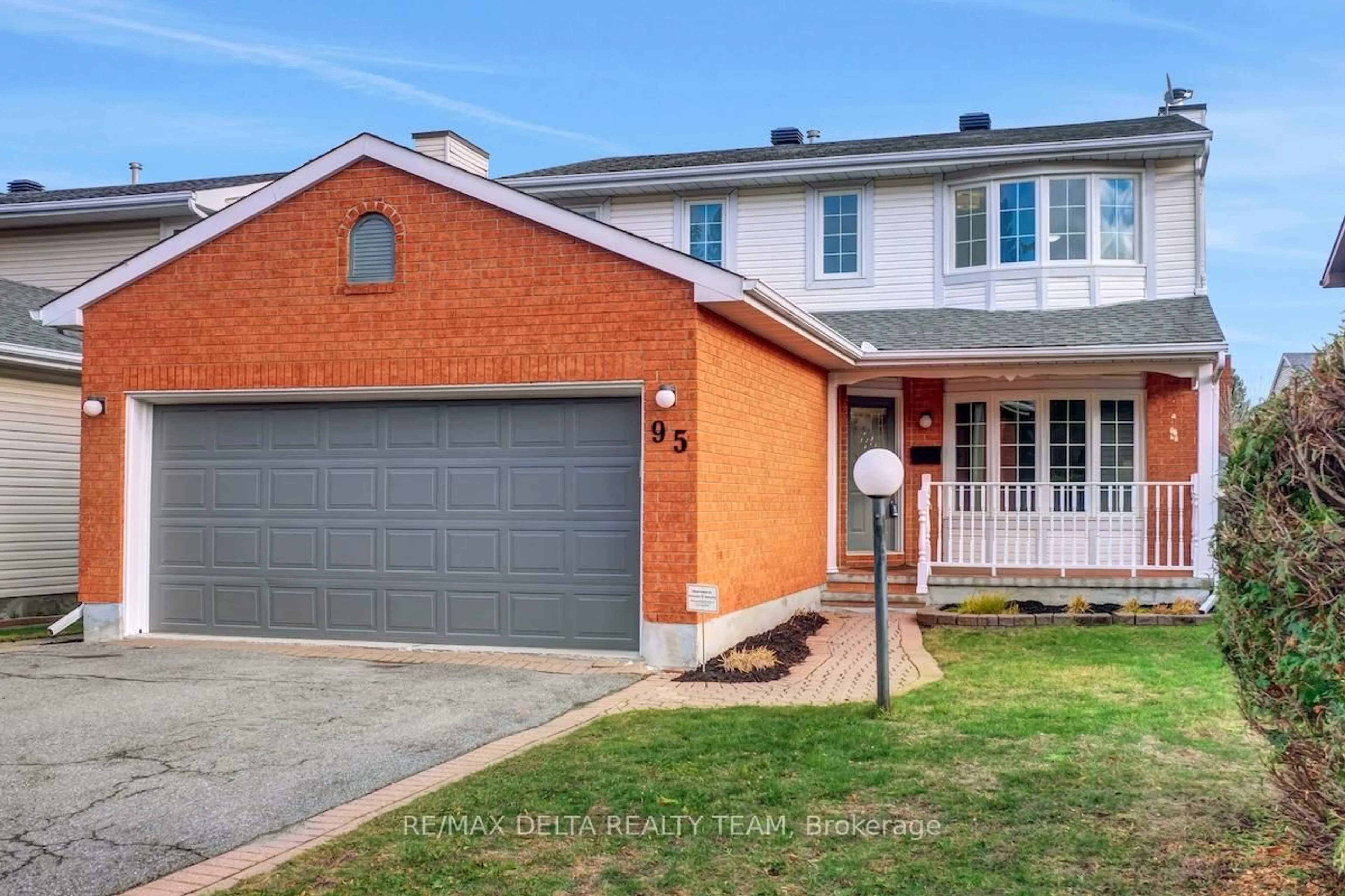 Home with brick exterior material, street for 95 Tartan Dr, Ottawa Ontario K2J 3V6