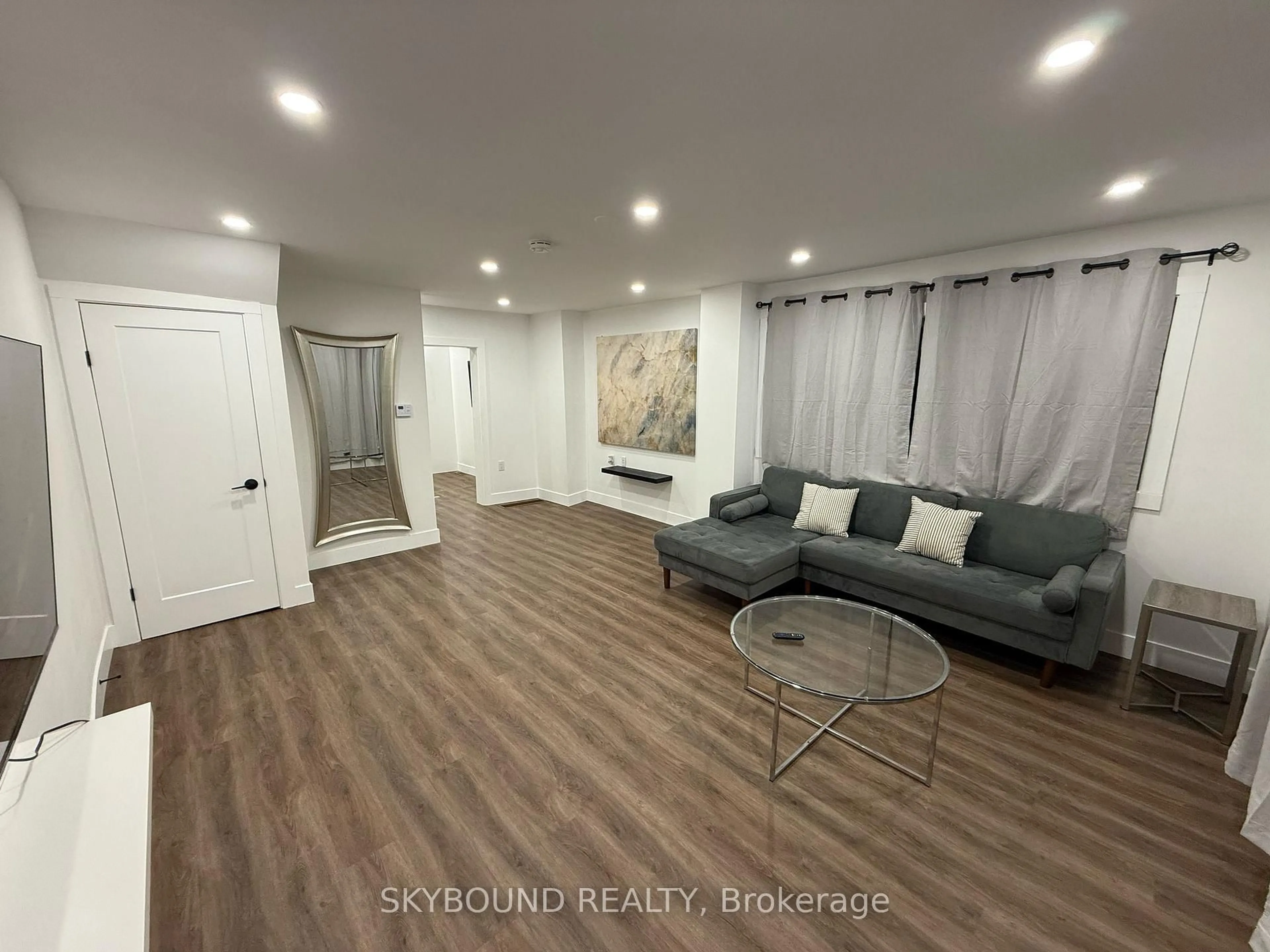 Living room with furniture, wood/laminate floor for 2042-44 Dundas St, Edwardsburgh/Cardinal Ontario K0E 1E0