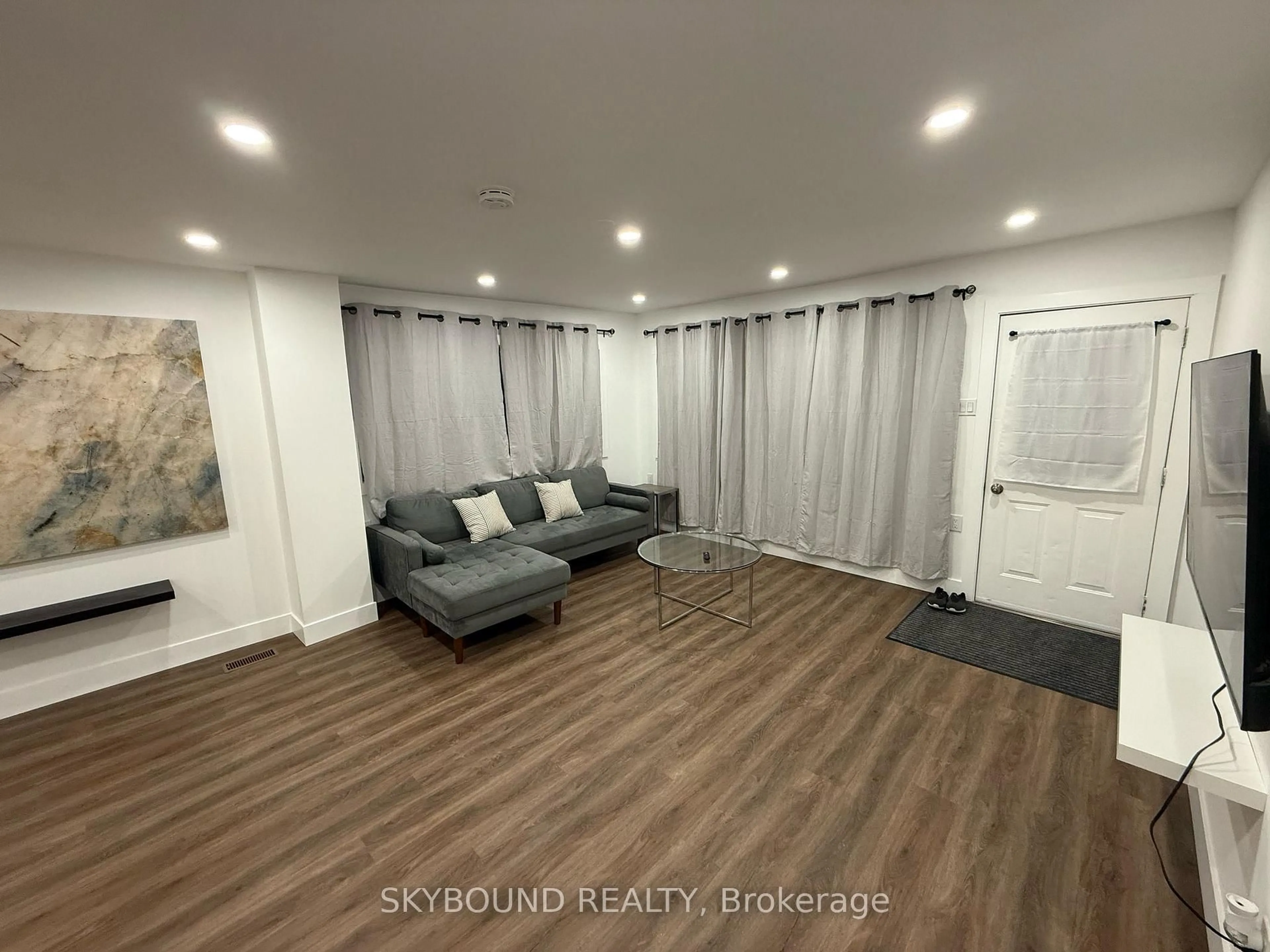 Living room with furniture, wood/laminate floor for 2042-44 Dundas St, Edwardsburgh/Cardinal Ontario K0E 1E0