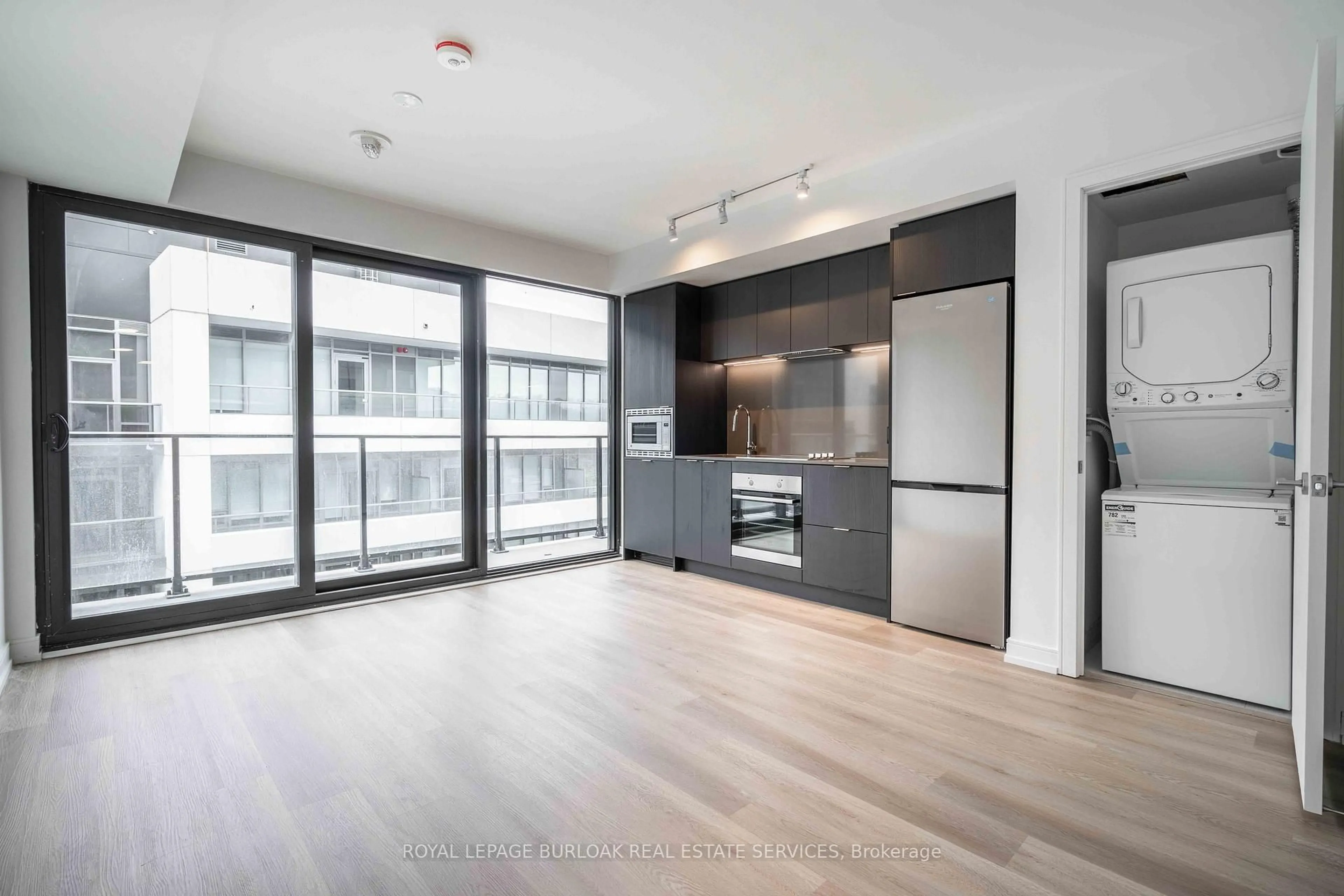 Open concept kitchen, wood/laminate floor for 1 Jarvis St #1418, Hamilton Ontario L8R 3J2