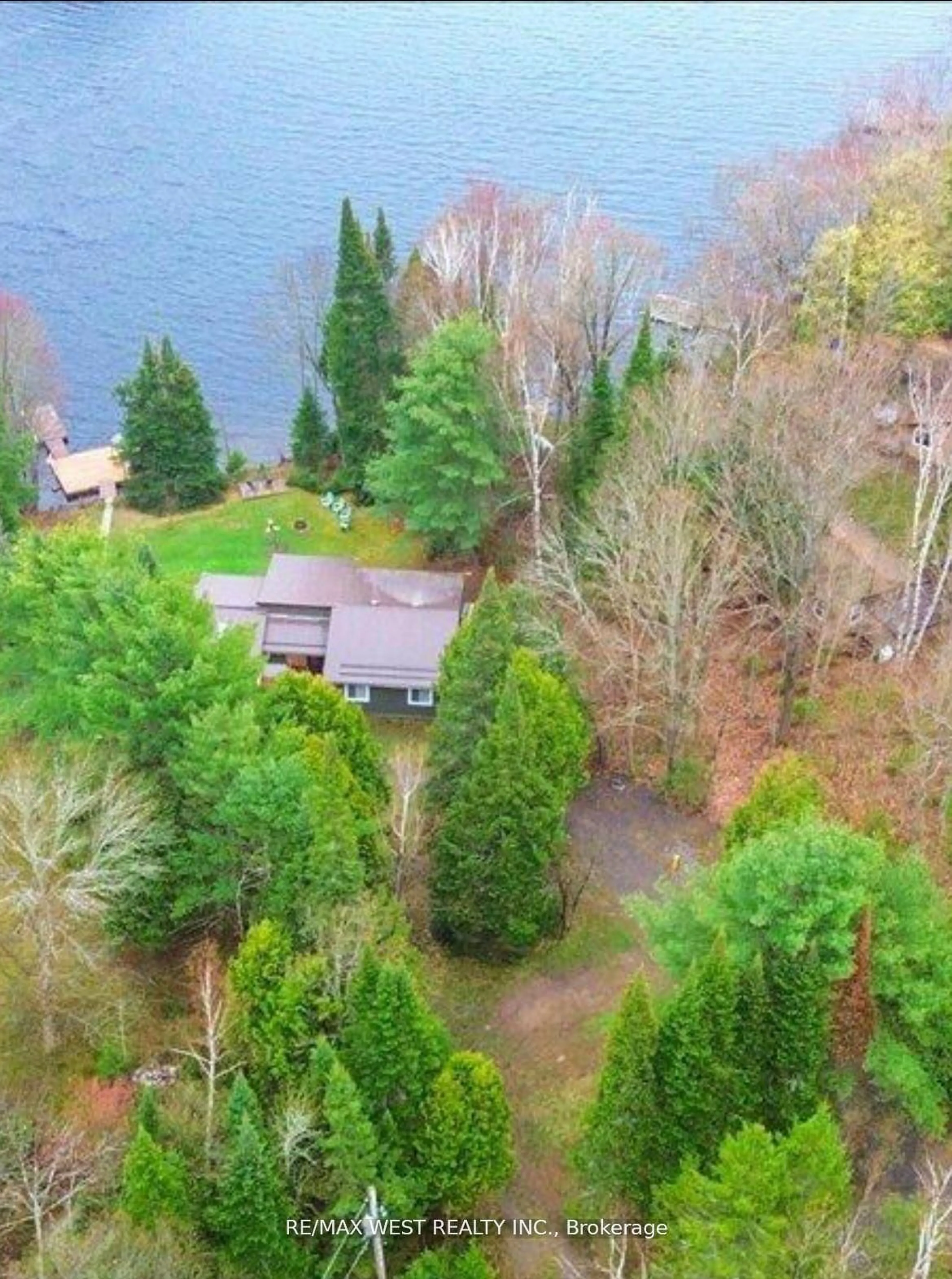 A pic from outside/outdoor area/front of a property/back of a property/a pic from drone, water/lake/river/ocean view for 1017 Rays Lane, Minden Hills Ontario K0M 2K0