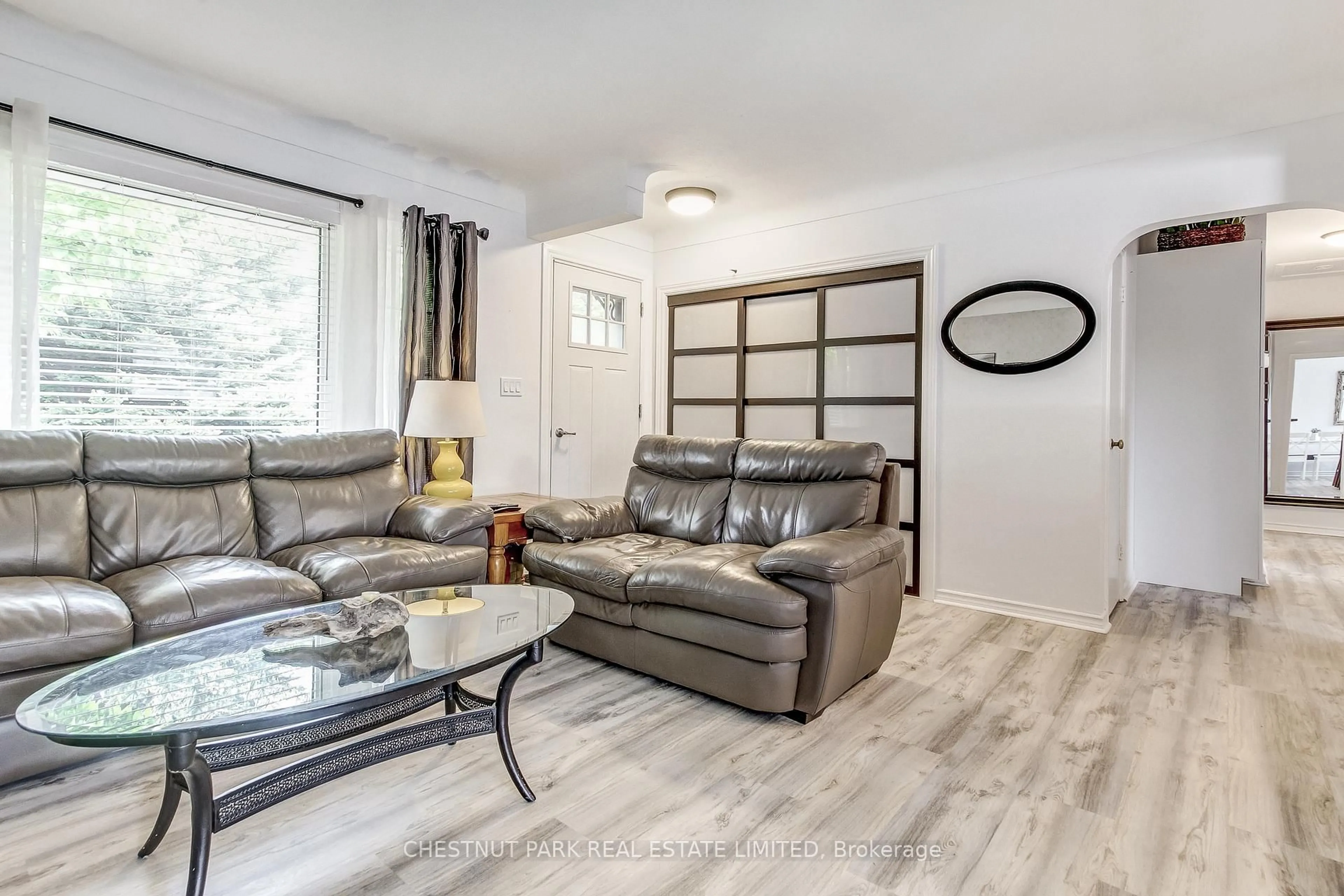 Living room with furniture, wood/laminate floor for 30 Mckenzie St, St. Catharines Ontario L2M 2N1