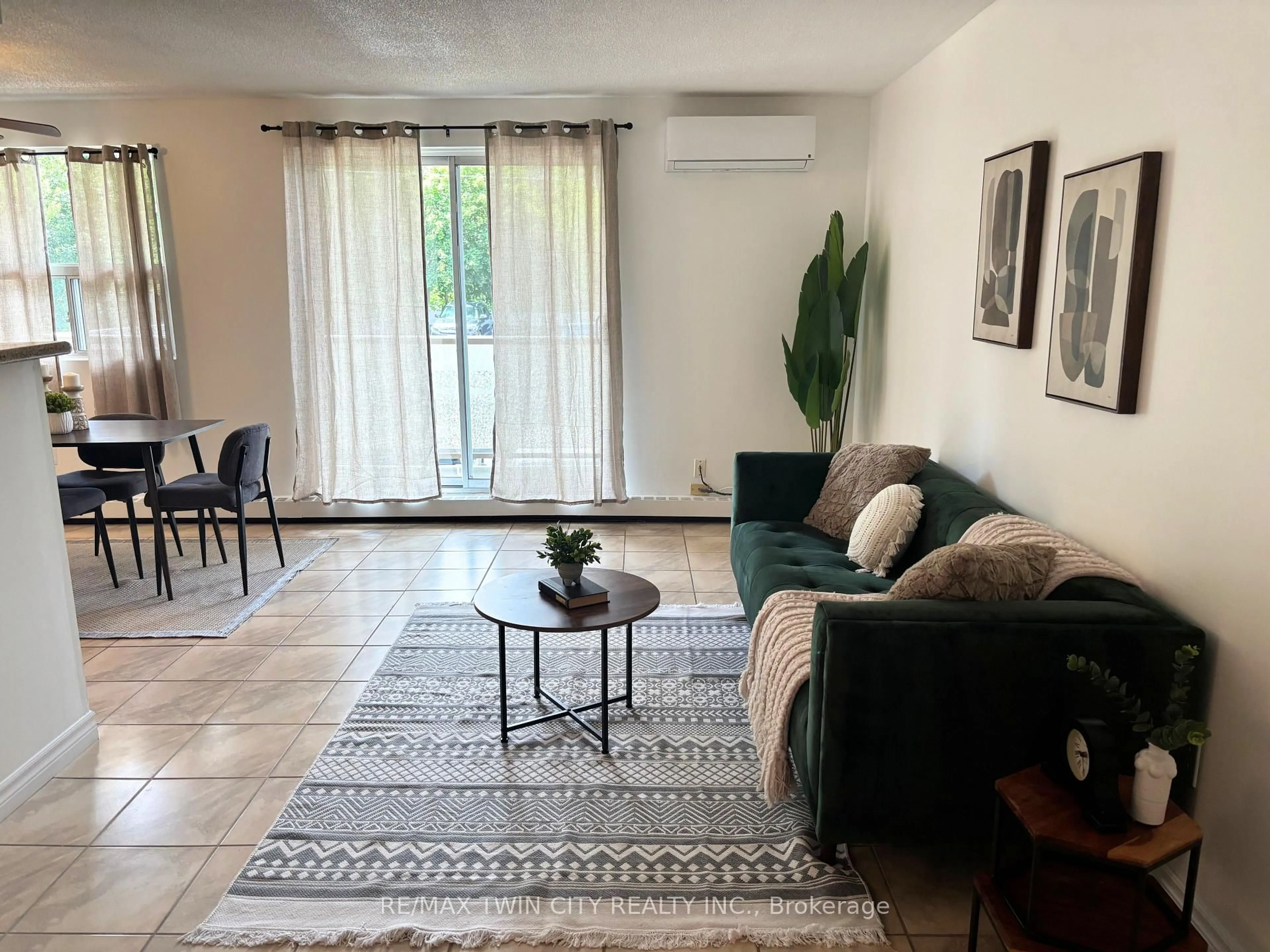 Living room with furniture, unknown for 793 Colborne St #207, Brantford Ontario N3S 7J3