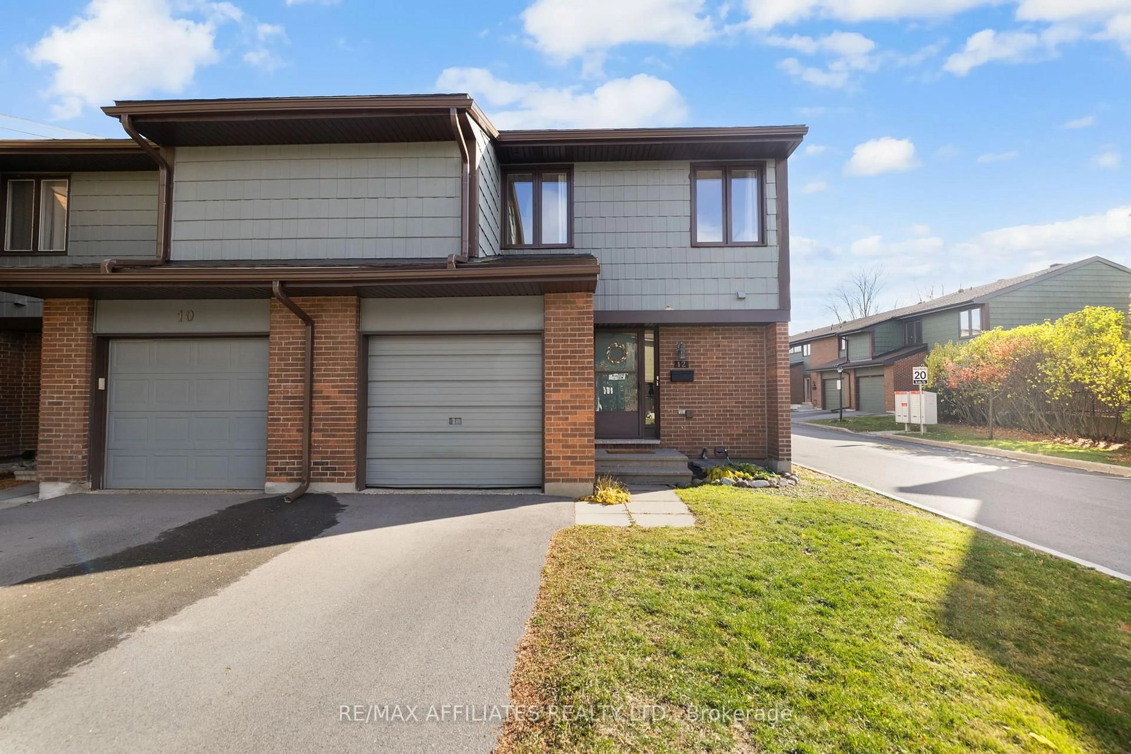 Home with brick exterior material, street for 12 Selye Cres, Ottawa Ontario K2K 1C9