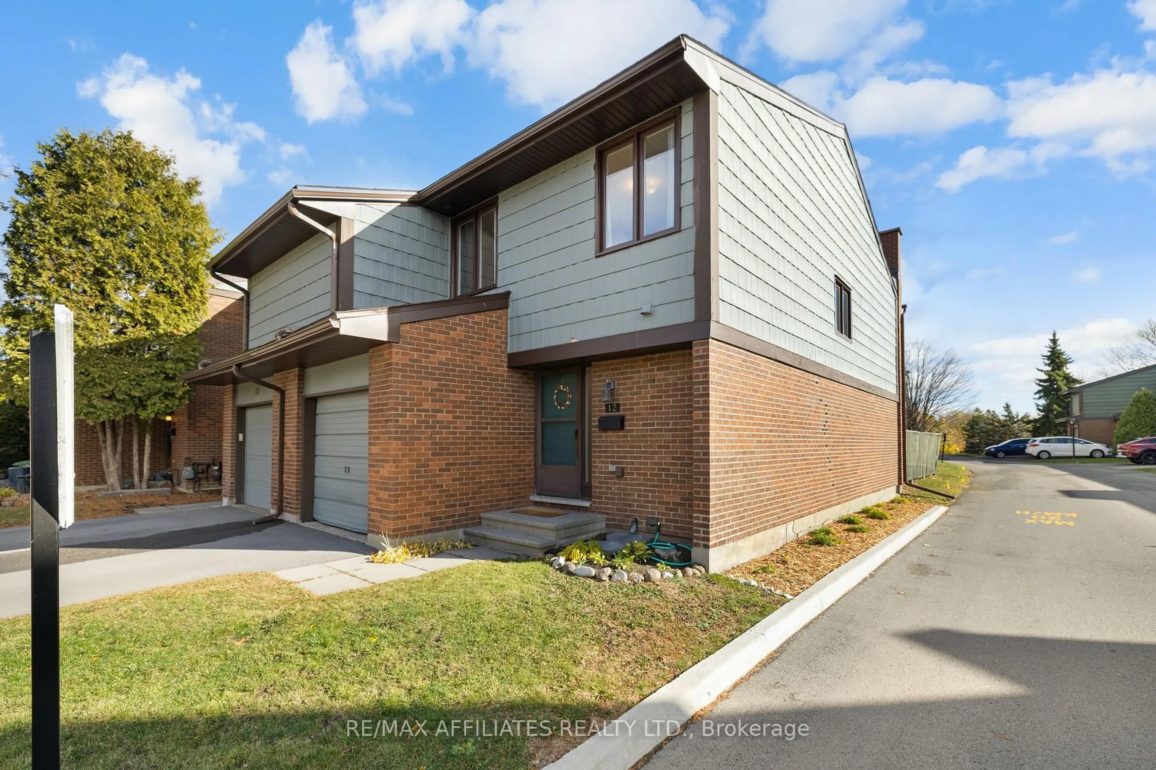Home with brick exterior material, street for 12 Selye Cres, Ottawa Ontario K2K 1C9