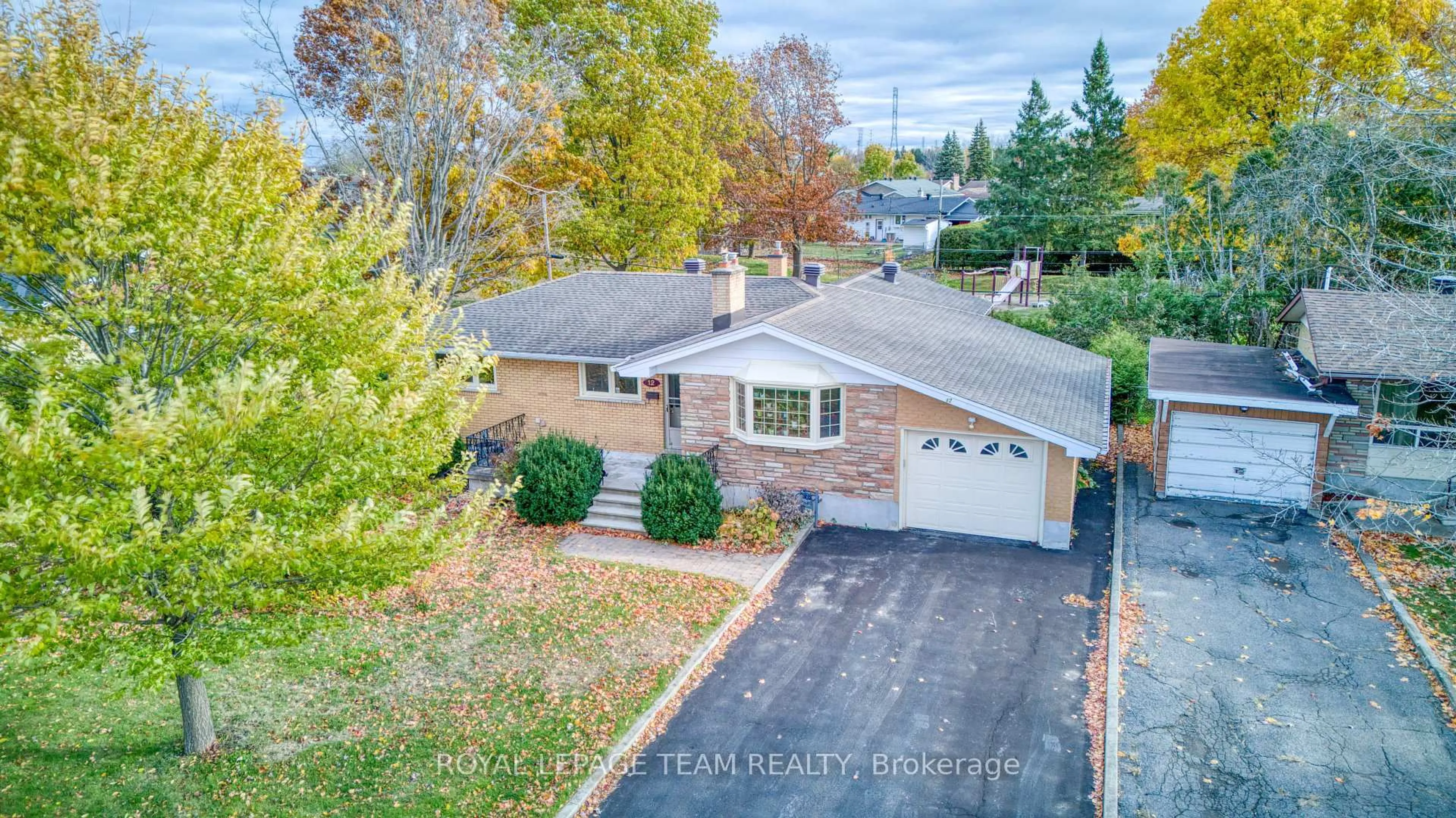 A pic from outside/outdoor area/front of a property/back of a property/a pic from drone, street for 12 Oakview Ave, Ottawa Ontario K2G 3A1