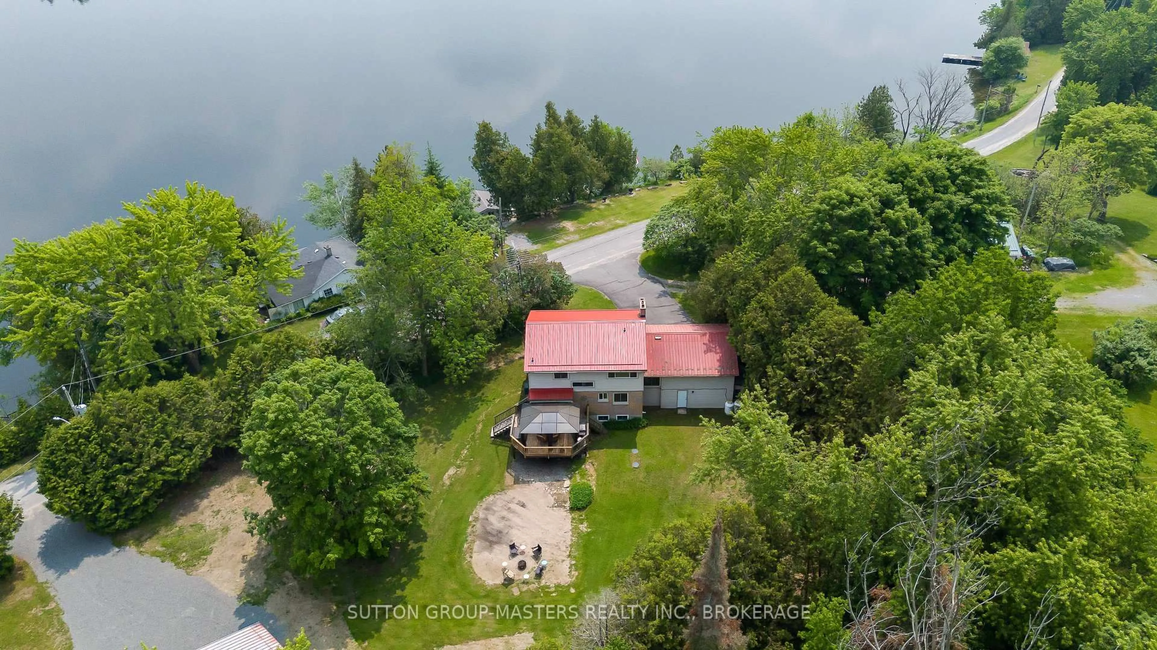 A pic from outside/outdoor area/front of a property/back of a property/a pic from drone, water/lake/river/ocean view for 4667 Clearwater Rd, Sydenham Ontario K0H 2T0
