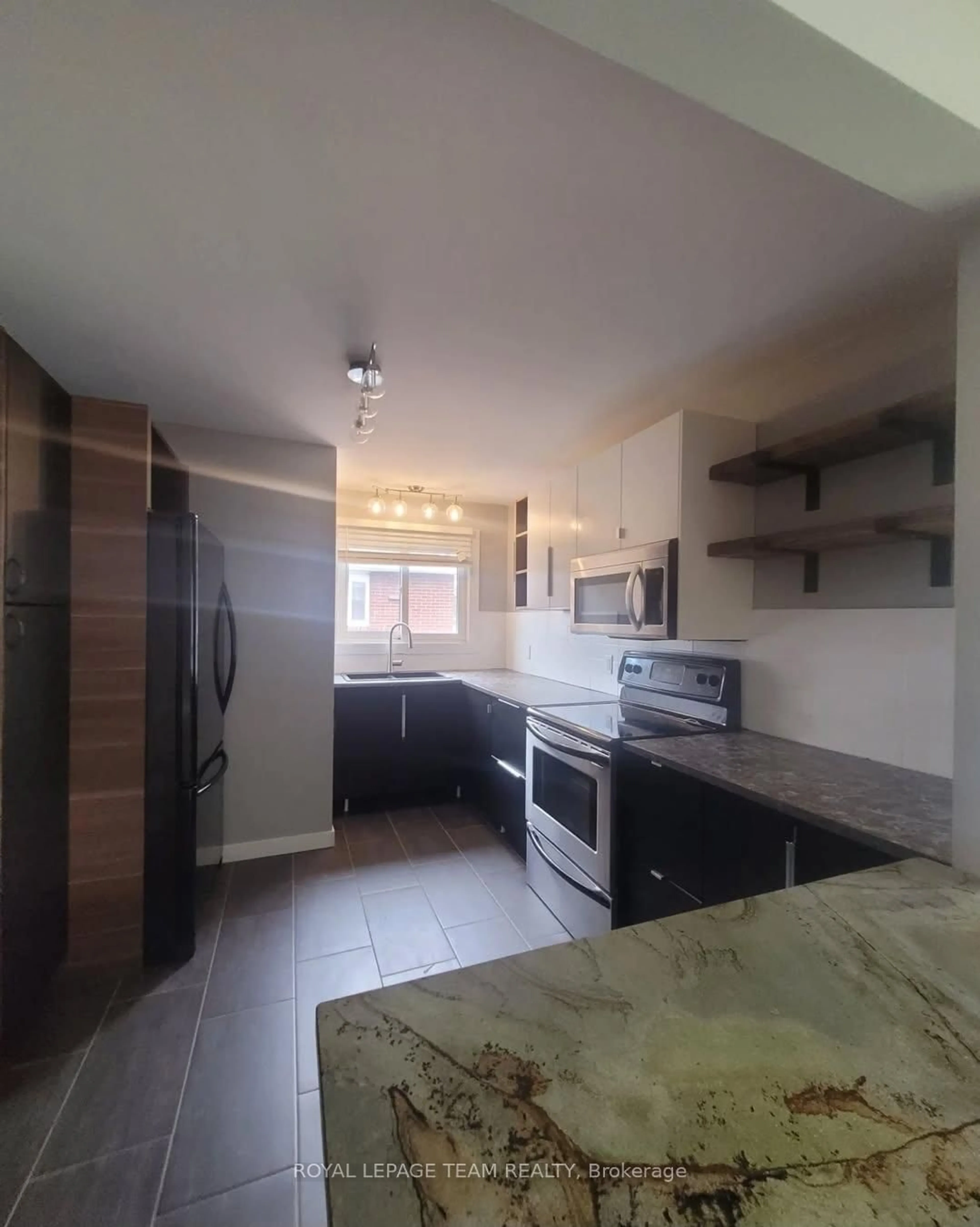 Open concept kitchen, ceramic/tile floor for 726 Cummings Ave, Ottawa Ontario K1K 2L1