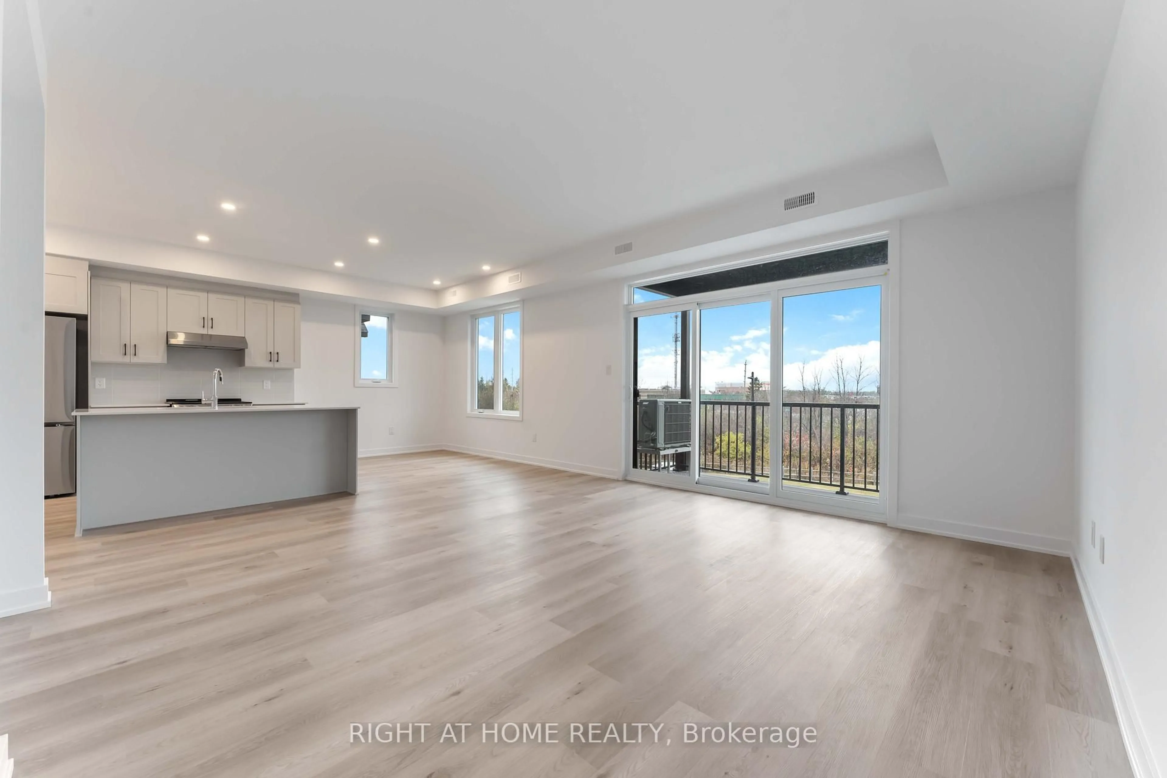 Open concept kitchen, wood/laminate floor for 20 Maize St #Unit 213 - 20F, Kanata Ontario K2S 3A9