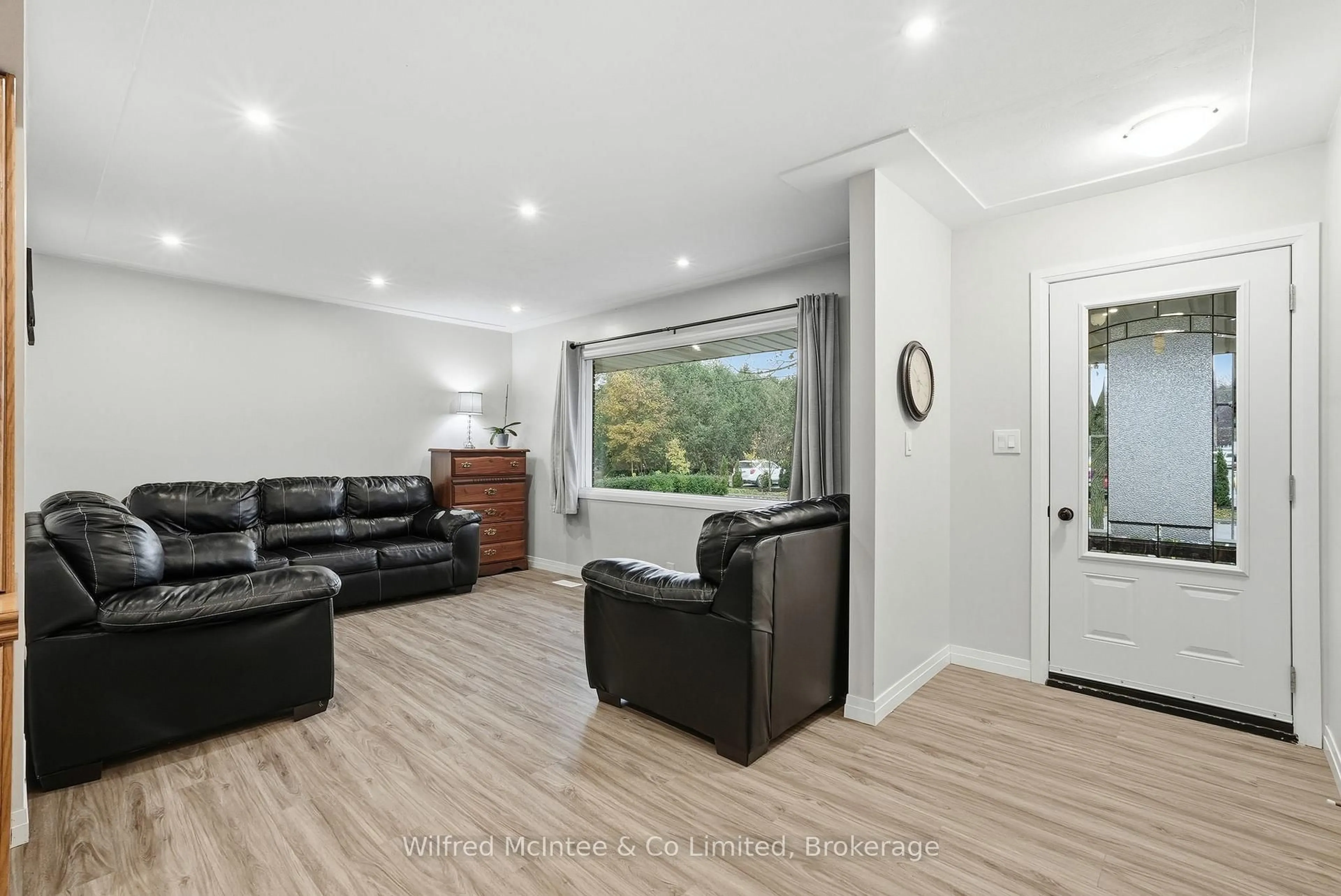 Living room with furniture, wood/laminate floor for 856 York Ave, North Perth Ontario N4W 2Y6