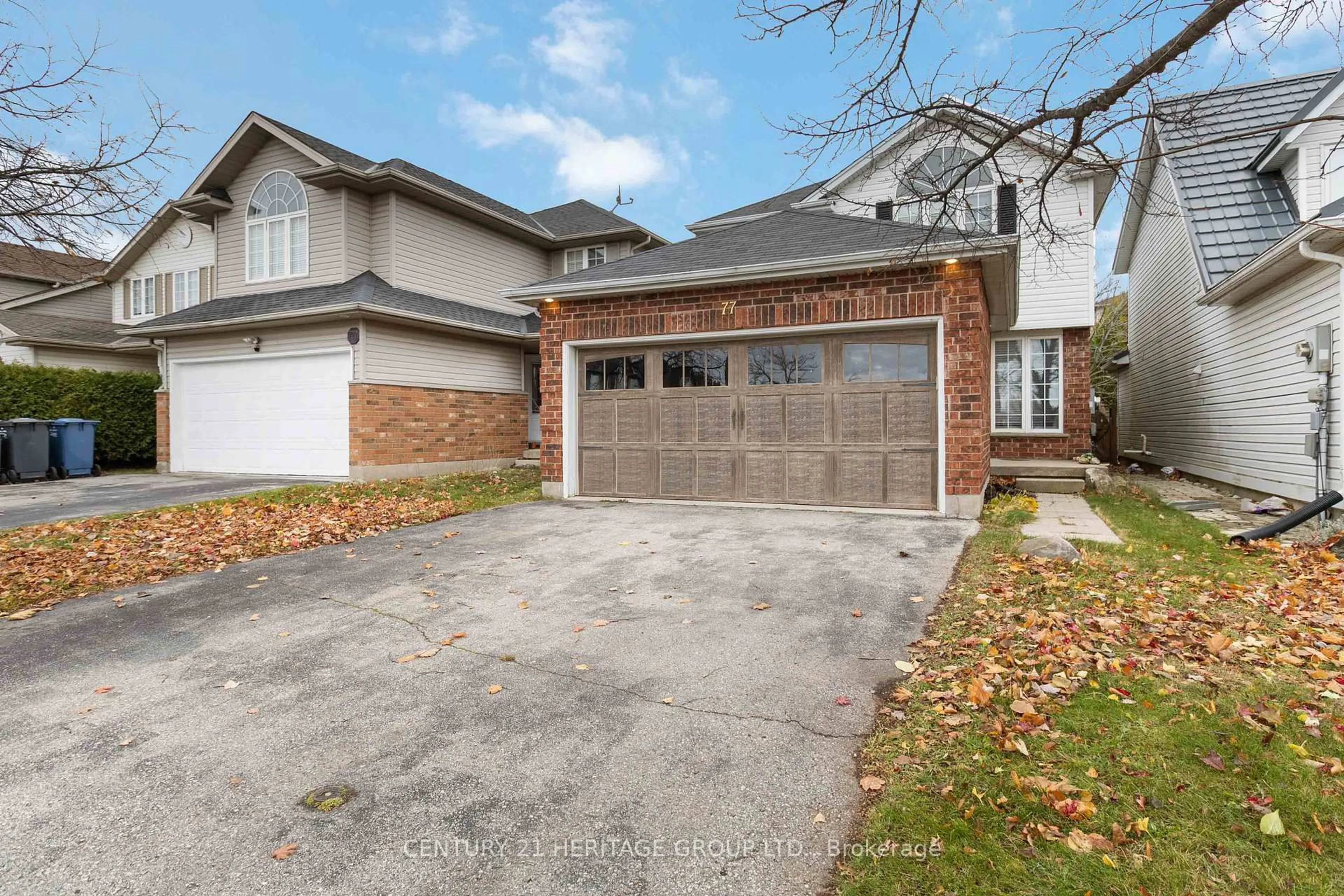 Home with brick exterior material, street for 77 Doyle Dr, Guelph Ontario N1G 5B9