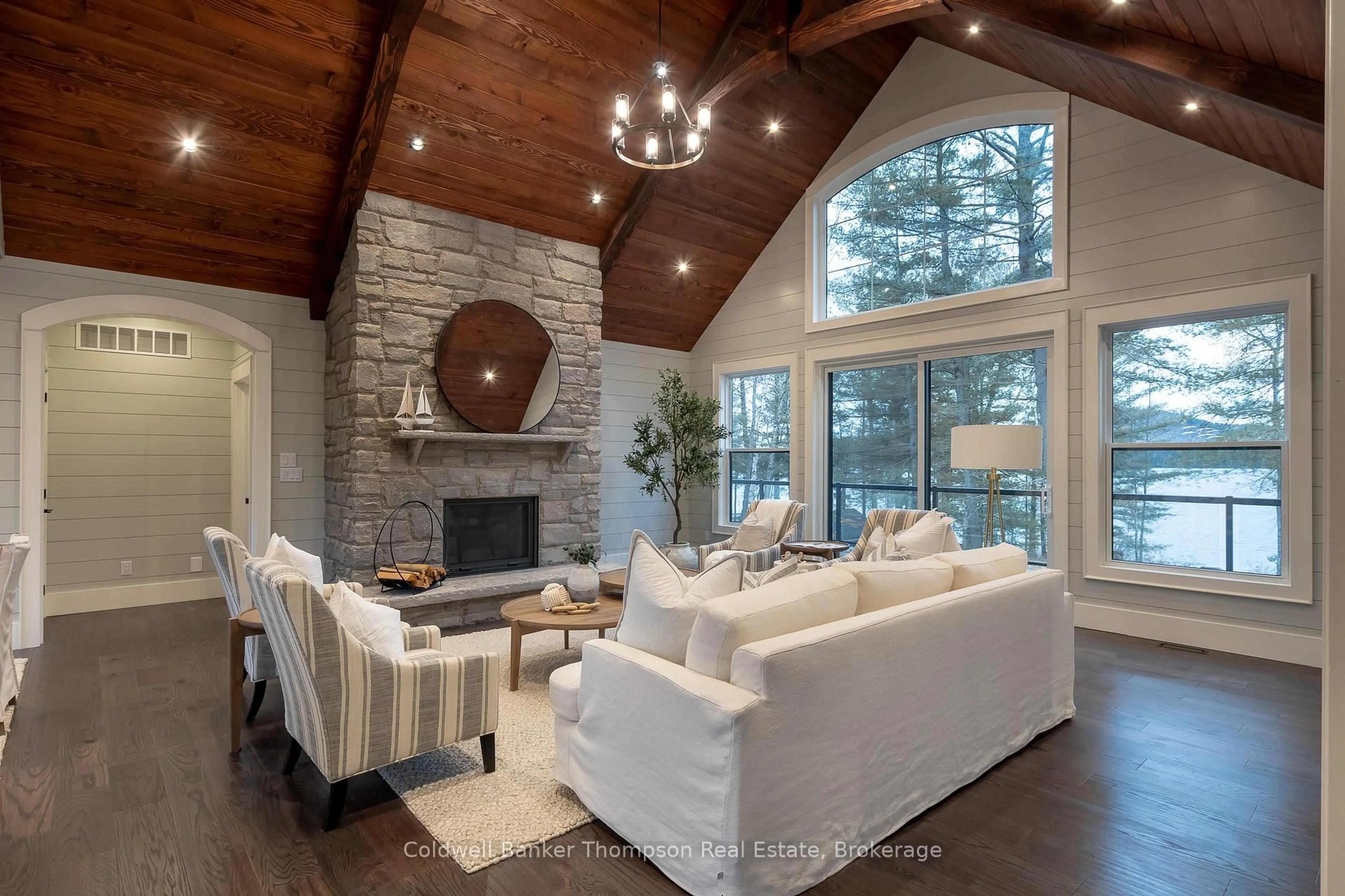 Living room with furniture, wood/laminate floor for 1204 Seabreeze Rd, Lake of Bays Ontario P0A 1H0