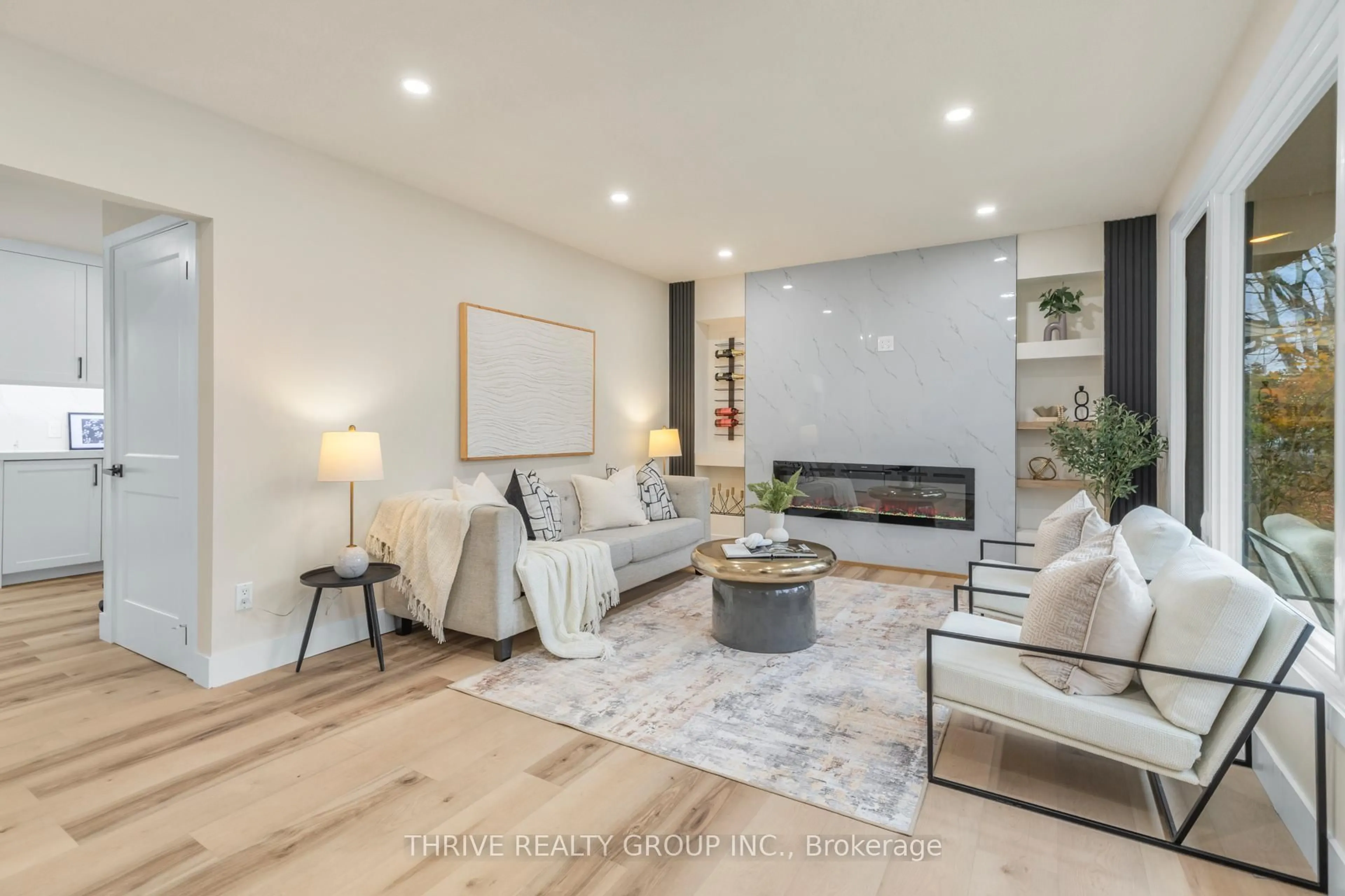 Living room with furniture, wood/laminate floor for 239 Commissioners Rd, London South Ontario N6J 1Y2
