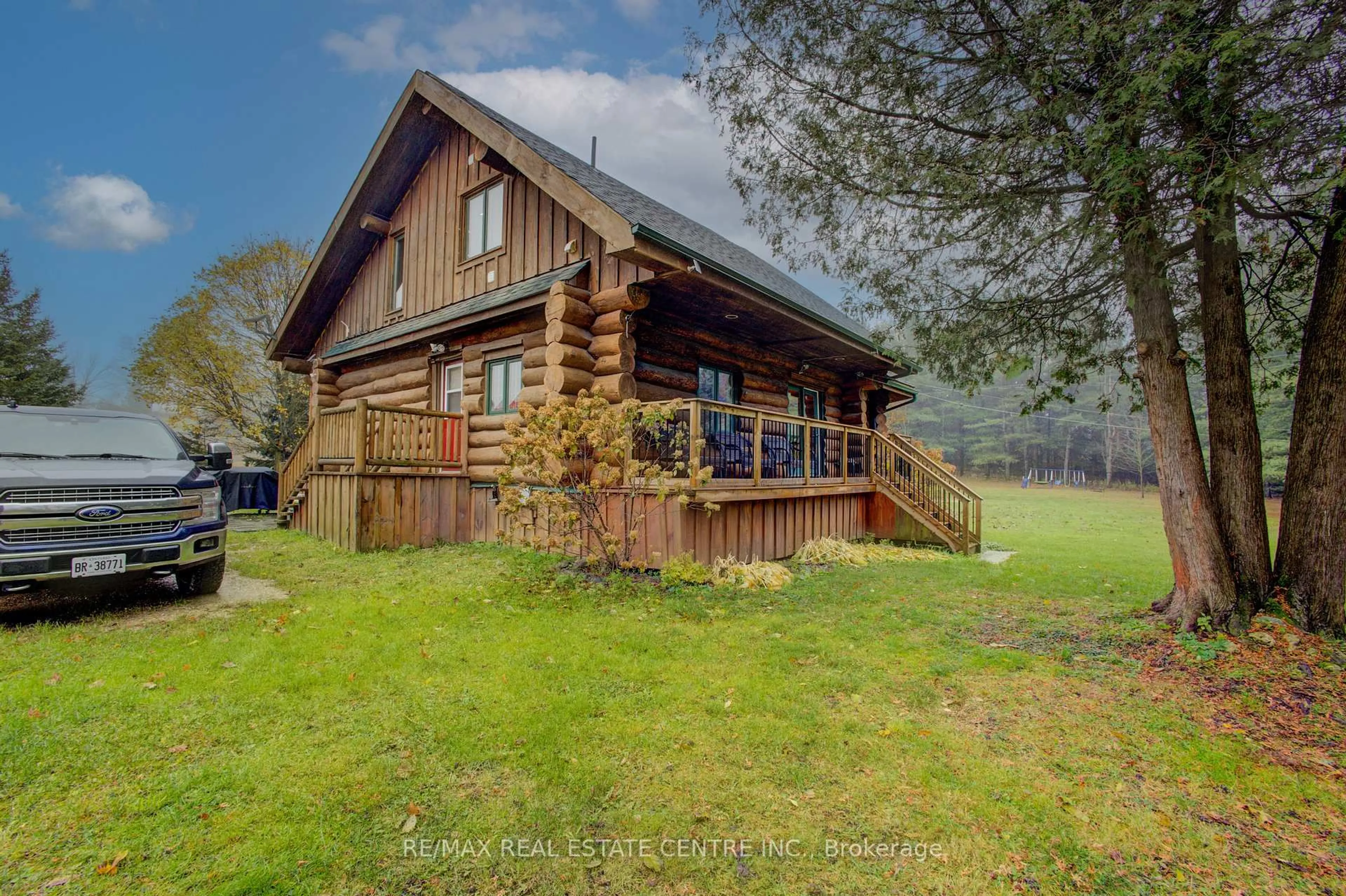 A pic from outside/outdoor area/front of a property/back of a property/a pic from drone, water/lake/river/ocean view for 312302 6 Highway, West Grey Ontario N0G 1C0