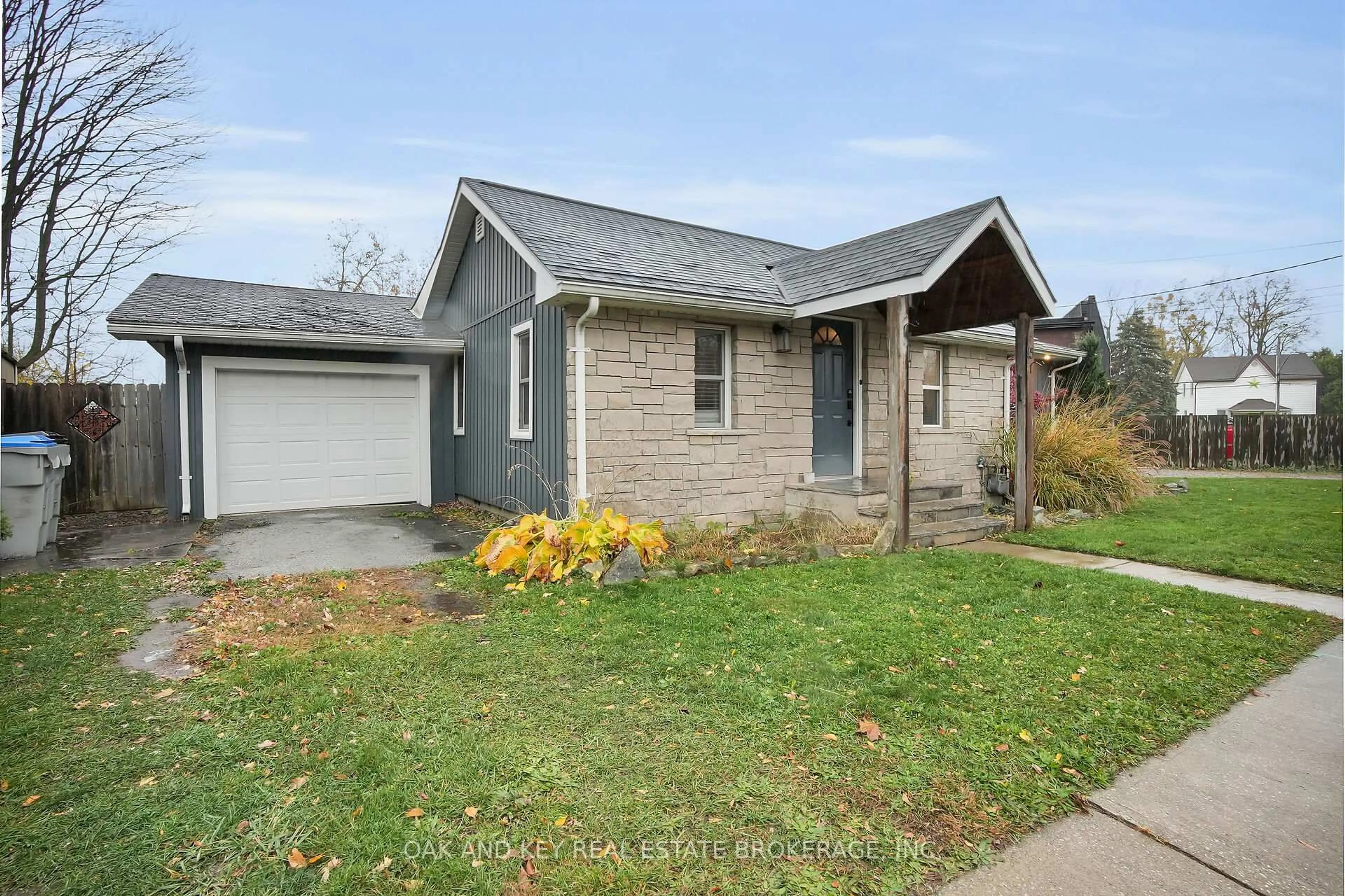 Home with vinyl exterior material, street for 15 Arthur St, Lambton Shores Ontario N0N 1J0