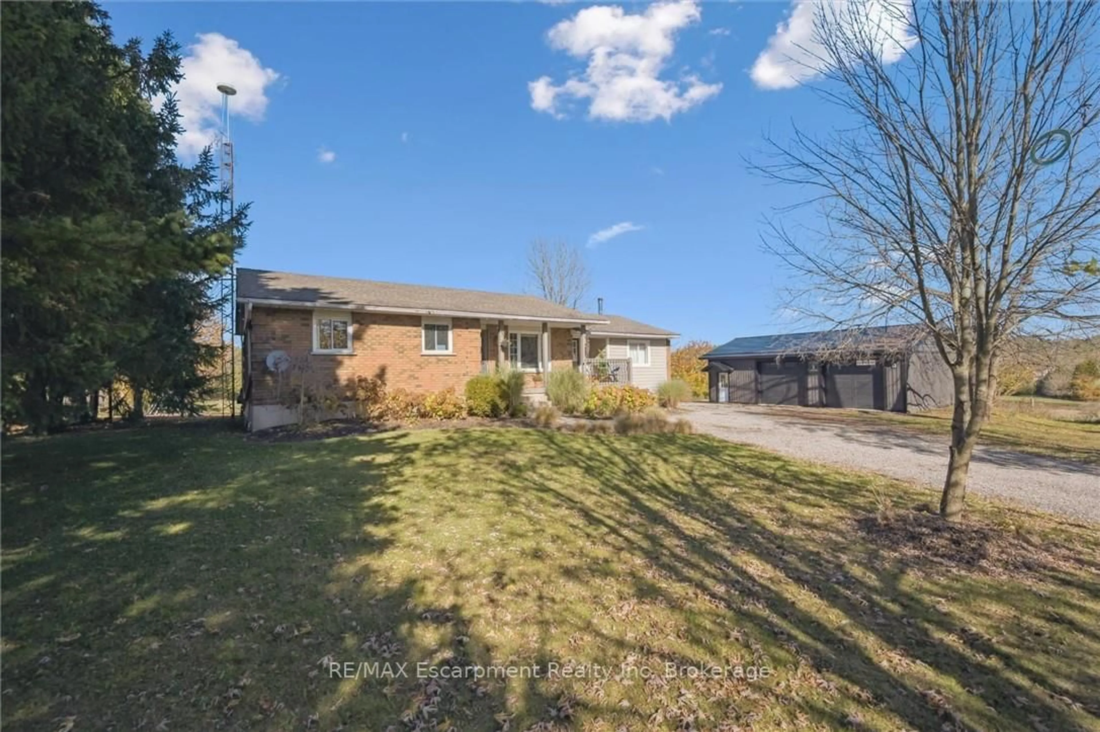 A pic from outside/outdoor area/front of a property/back of a property/a pic from drone, street for 323135 Durham Rd, West Grey Ontario N0G 1R0