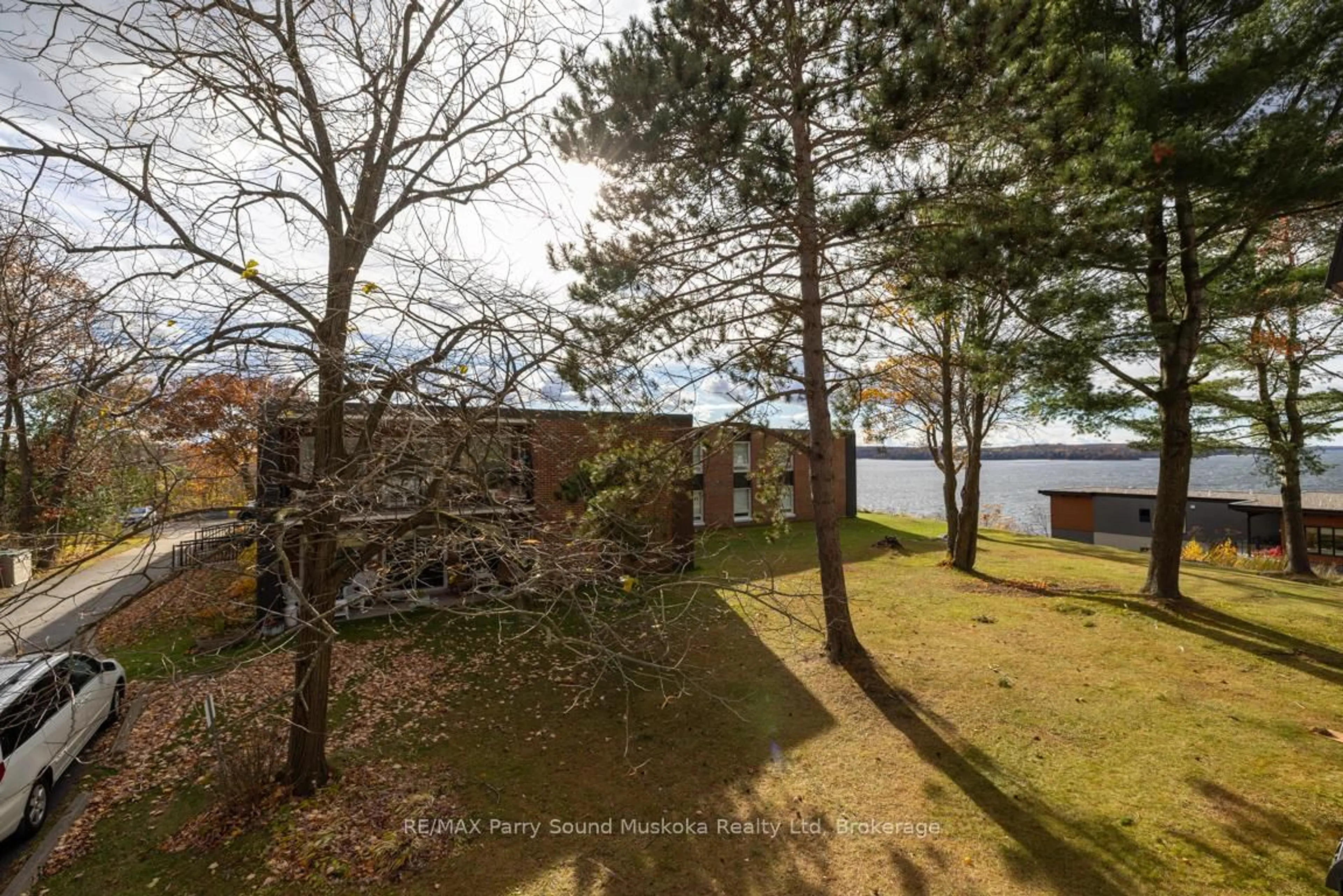A pic from outside/outdoor area/front of a property/back of a property/a pic from drone, water/lake/river/ocean view for 200 Beaconview Hts #201, Parry Sound Ontario P2A 2E1