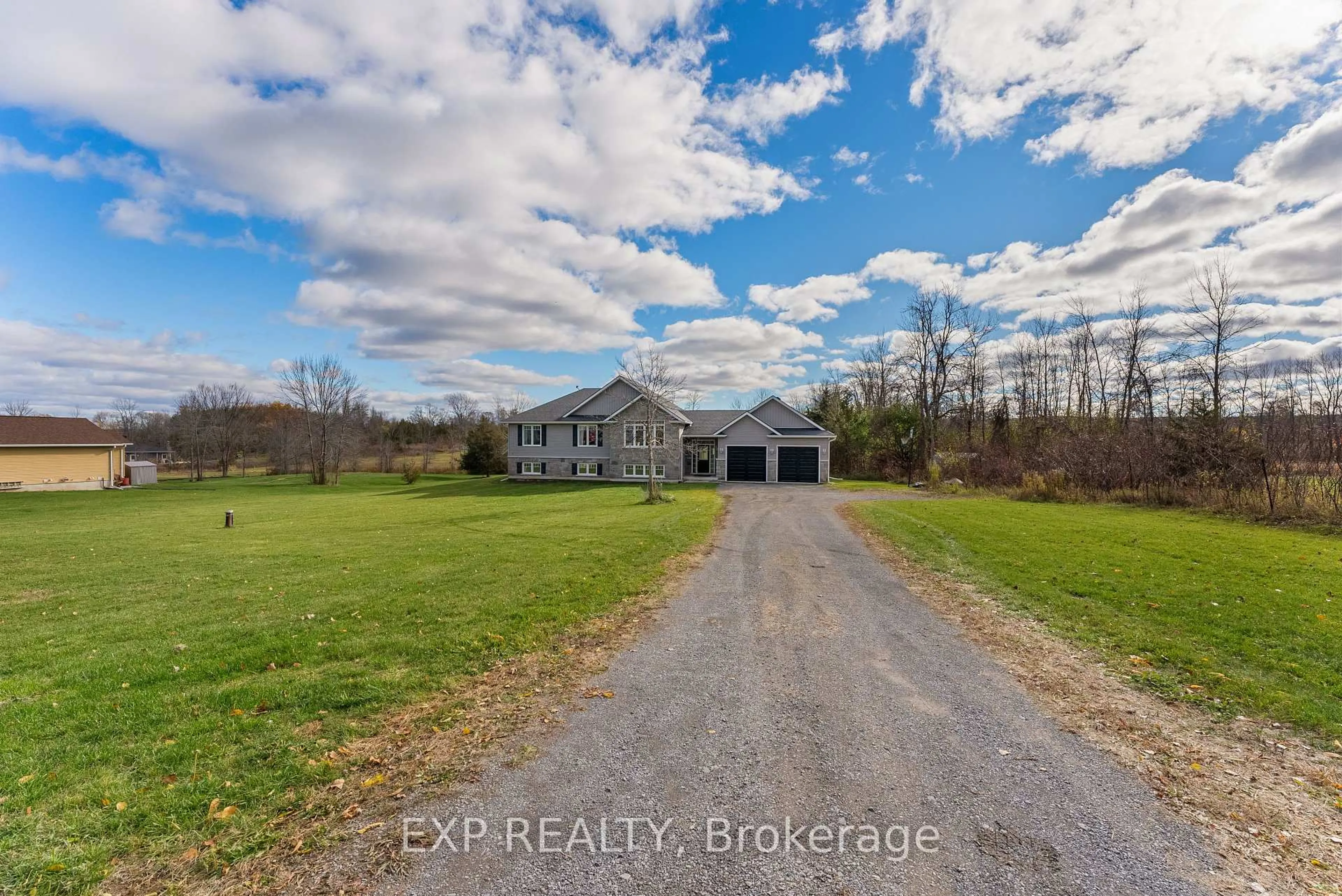 A pic from outside/outdoor area/front of a property/back of a property/a pic from drone, water/lake/river/ocean view for 2986 County Road 15, Prince Edward County Ontario K0K 2T0