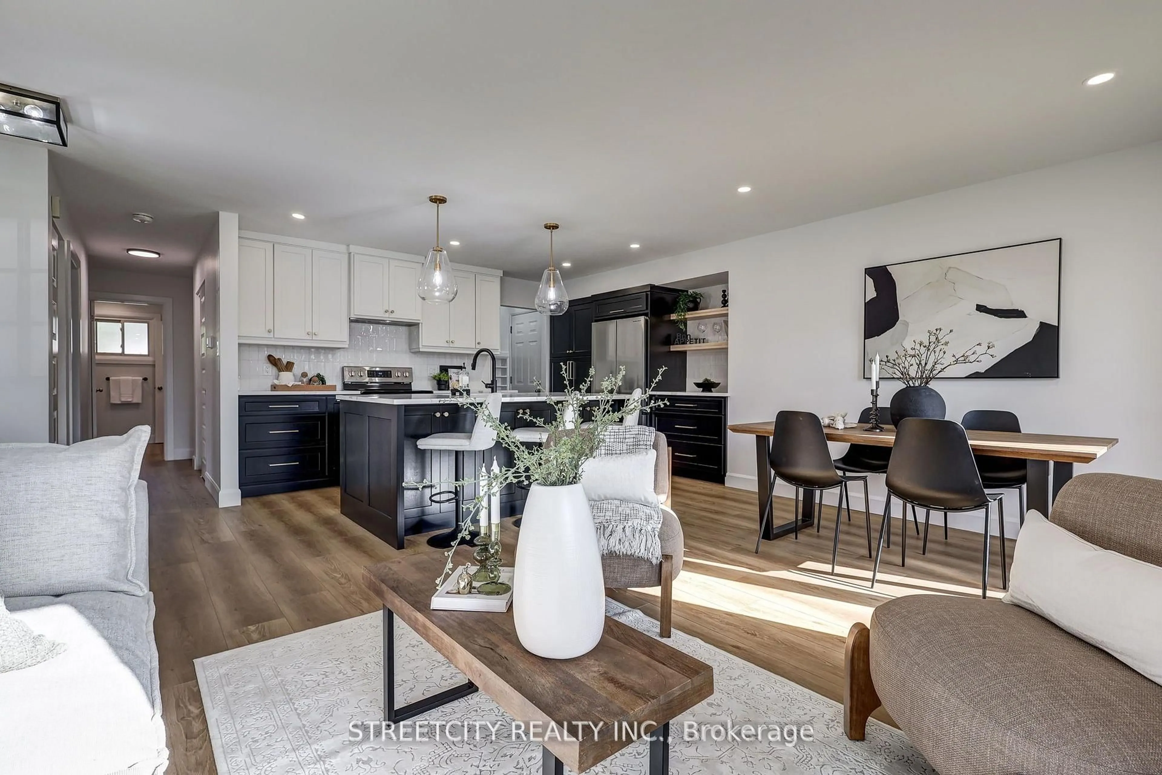 Open concept kitchen, wood/laminate floor for 58 Manor Rd, St. Thomas Ontario N5R 5N7