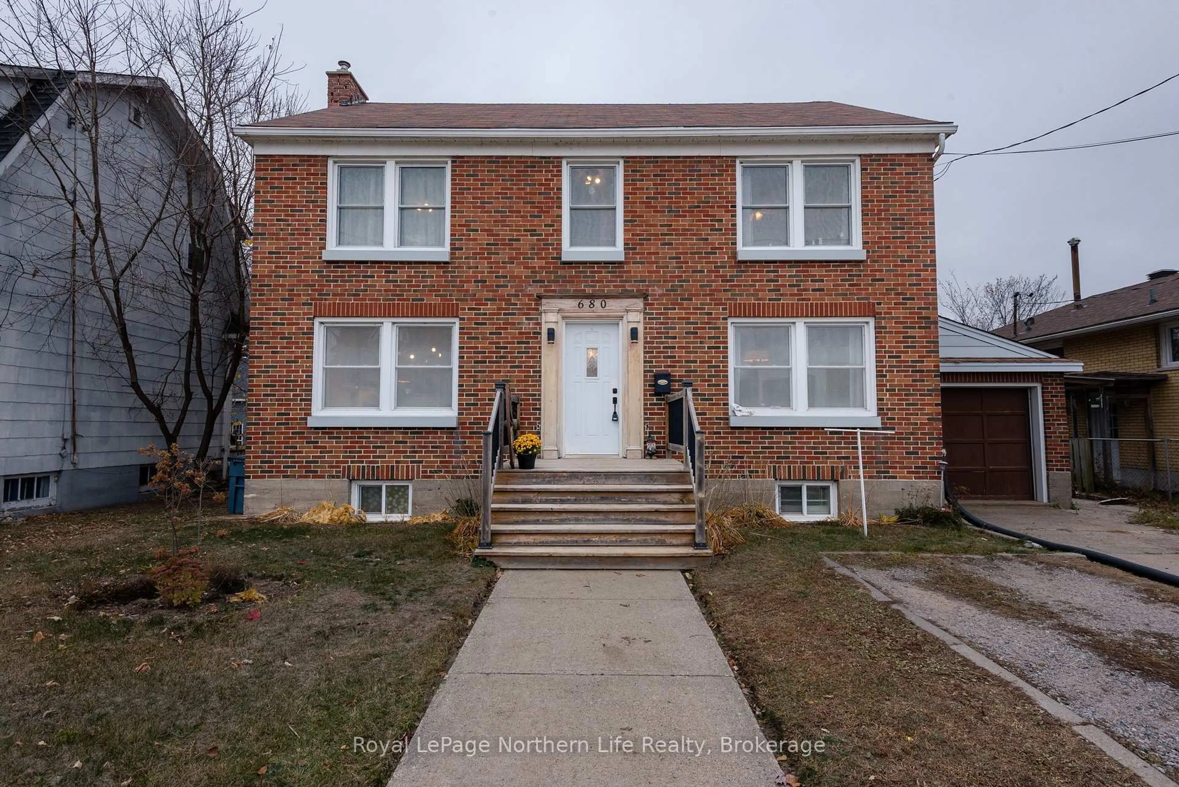 Home with brick exterior material, street for 680 Main St, North Bay Ontario P1B 2V5