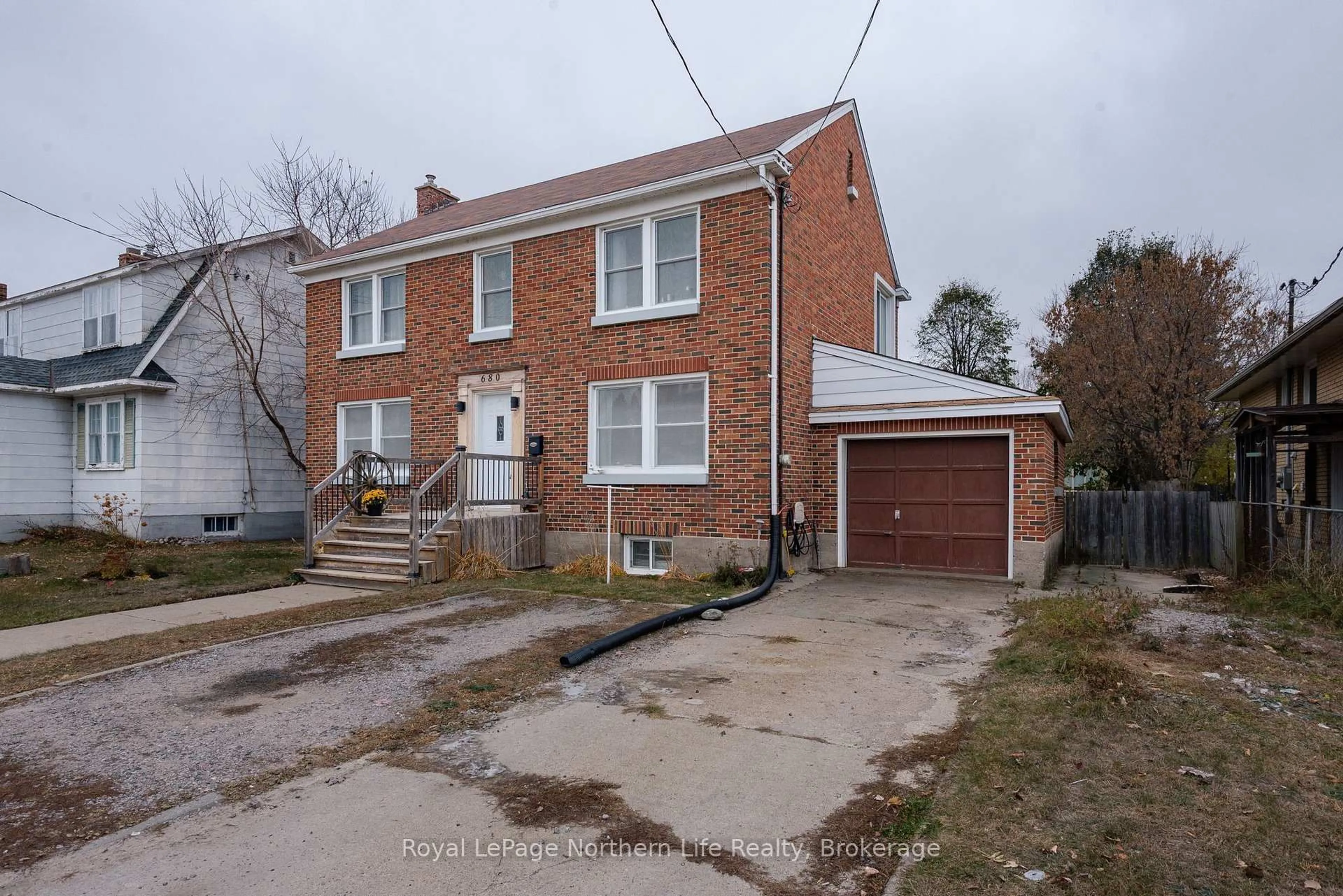 Home with brick exterior material, street for 680 Main St, North Bay Ontario P1B 2V5