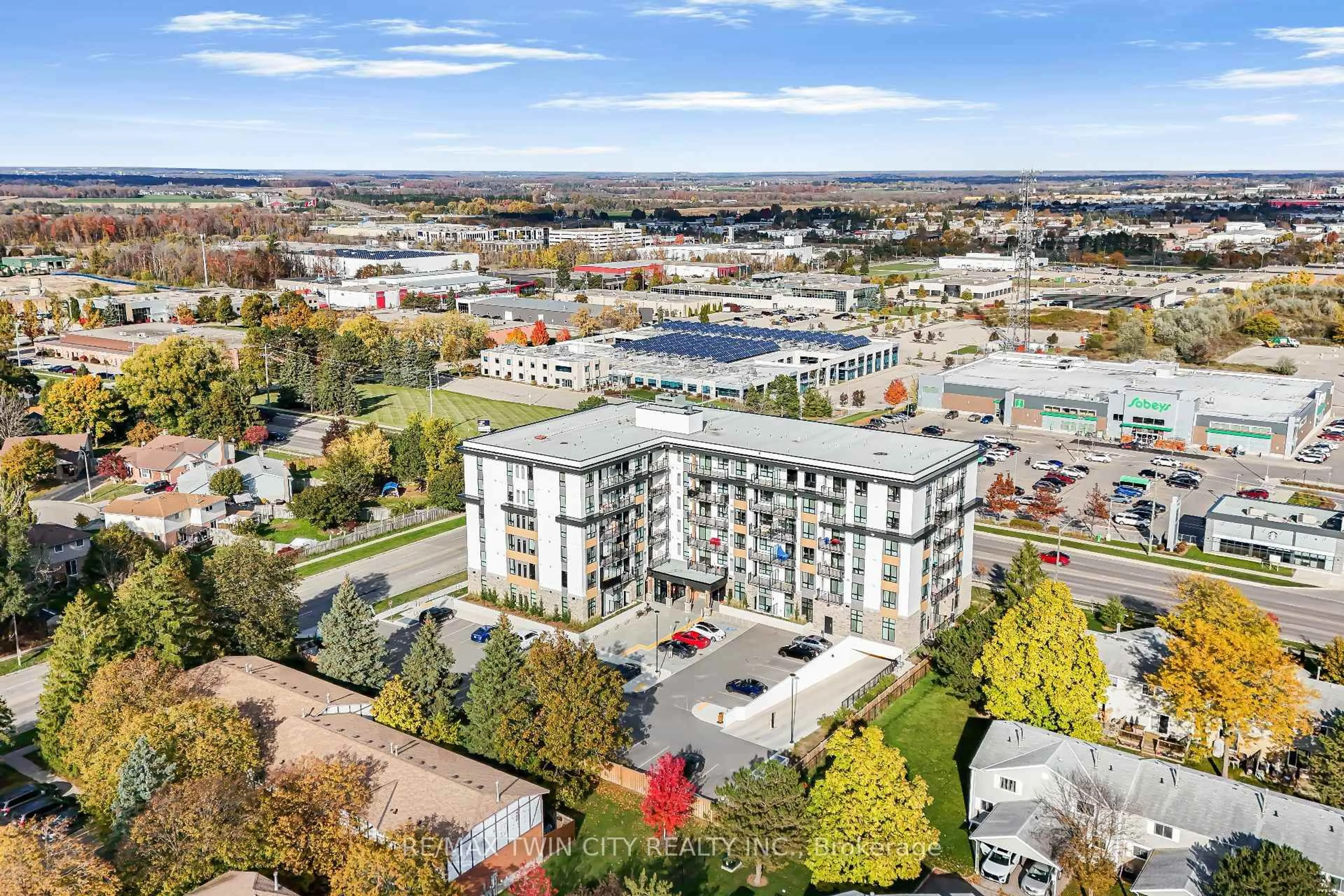 A pic from outside/outdoor area/front of a property/back of a property/a pic from drone, city buildings view from balcony for 101 Golden Eagle Rd #404, Waterloo Ontario N2V 1C3