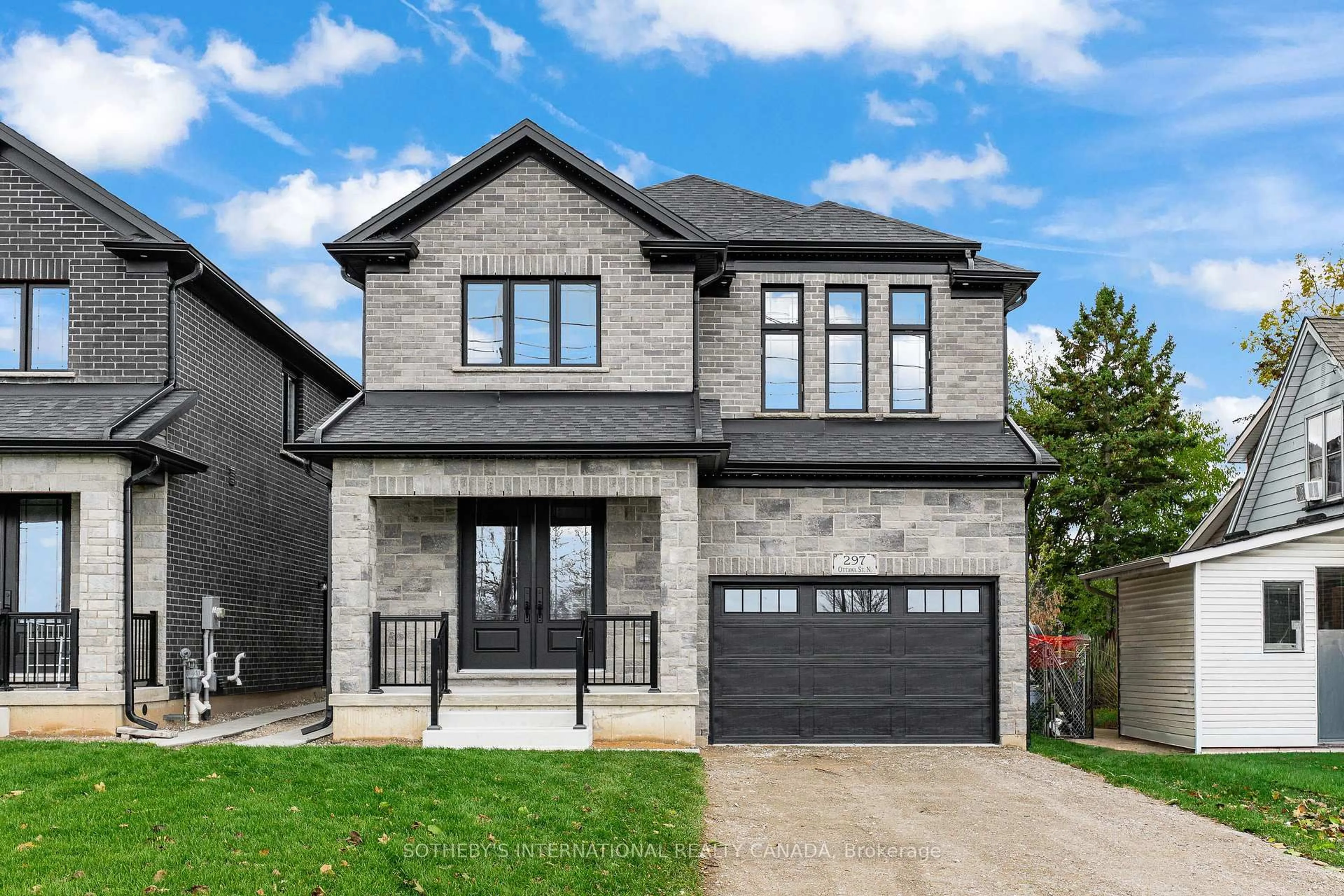 Home with brick exterior material, street for 297 Ottawa St, Kitchener Ontario N2H 3K9