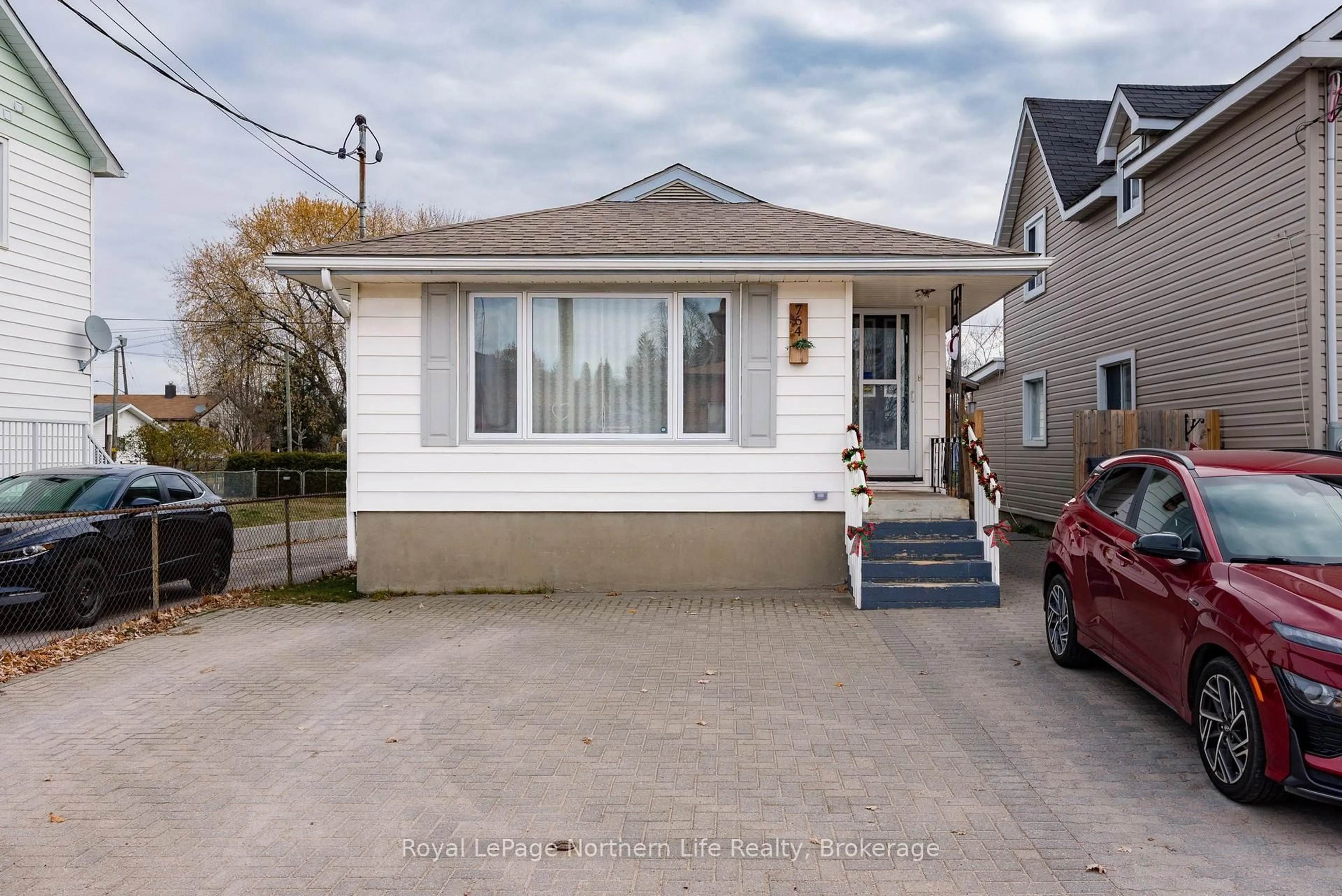 Home with vinyl exterior material, street for 764 O'Brien St, North Bay Ontario P1B 5W7