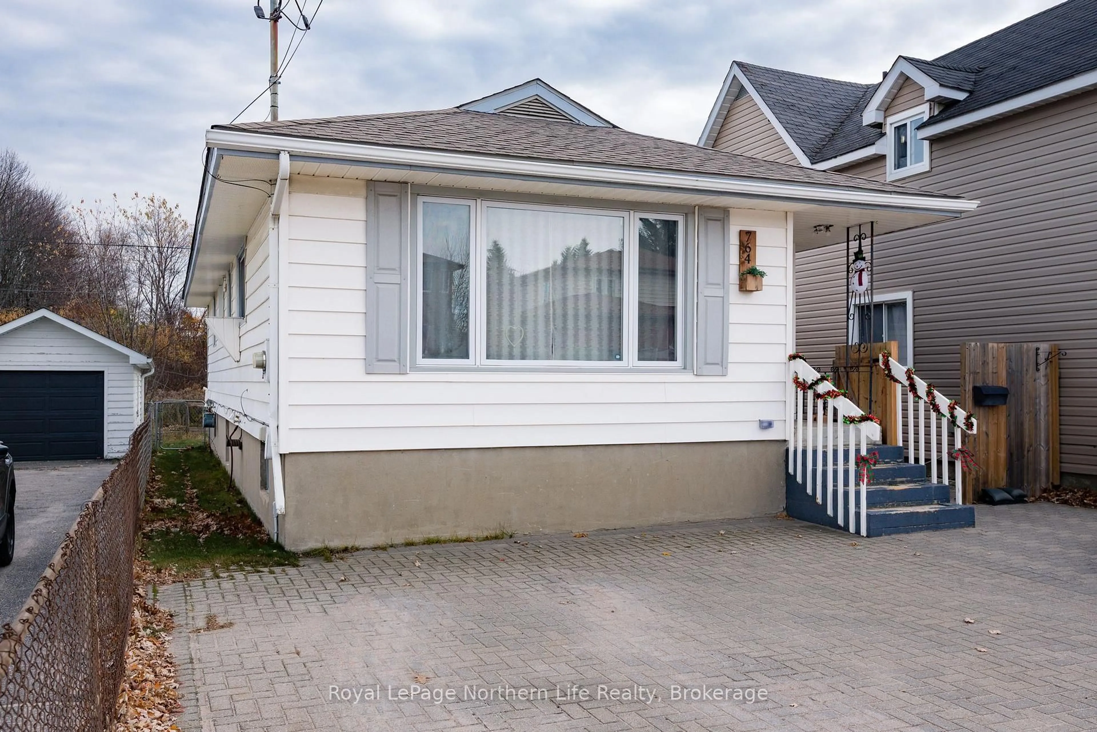 Home with vinyl exterior material, street for 764 O'Brien St, North Bay Ontario P1B 5W7