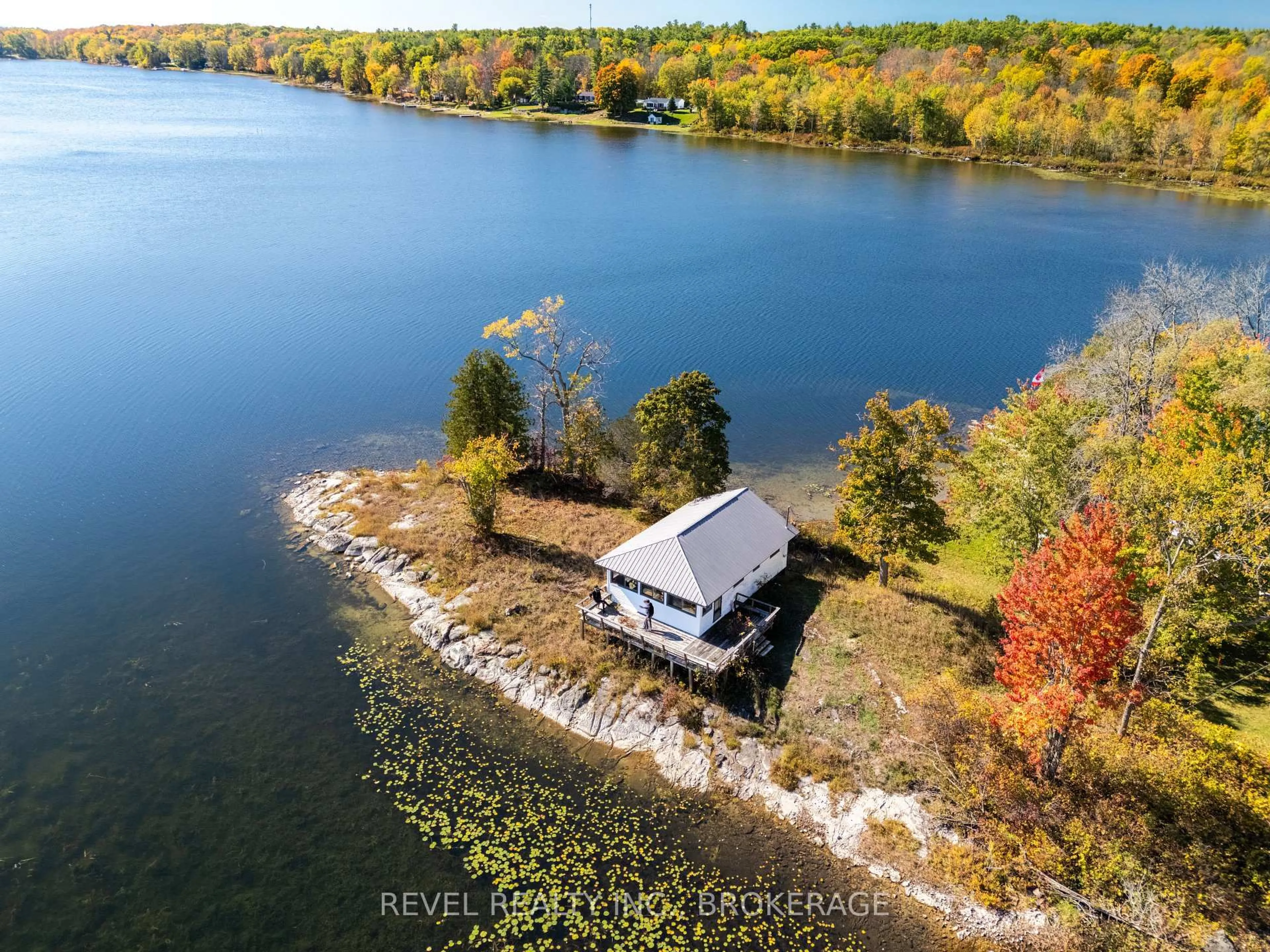 A pic from outside/outdoor area/front of a property/back of a property/a pic from drone, water/lake/river/ocean view for 1019A Kens Lane, Verona Ontario K0H 2W0