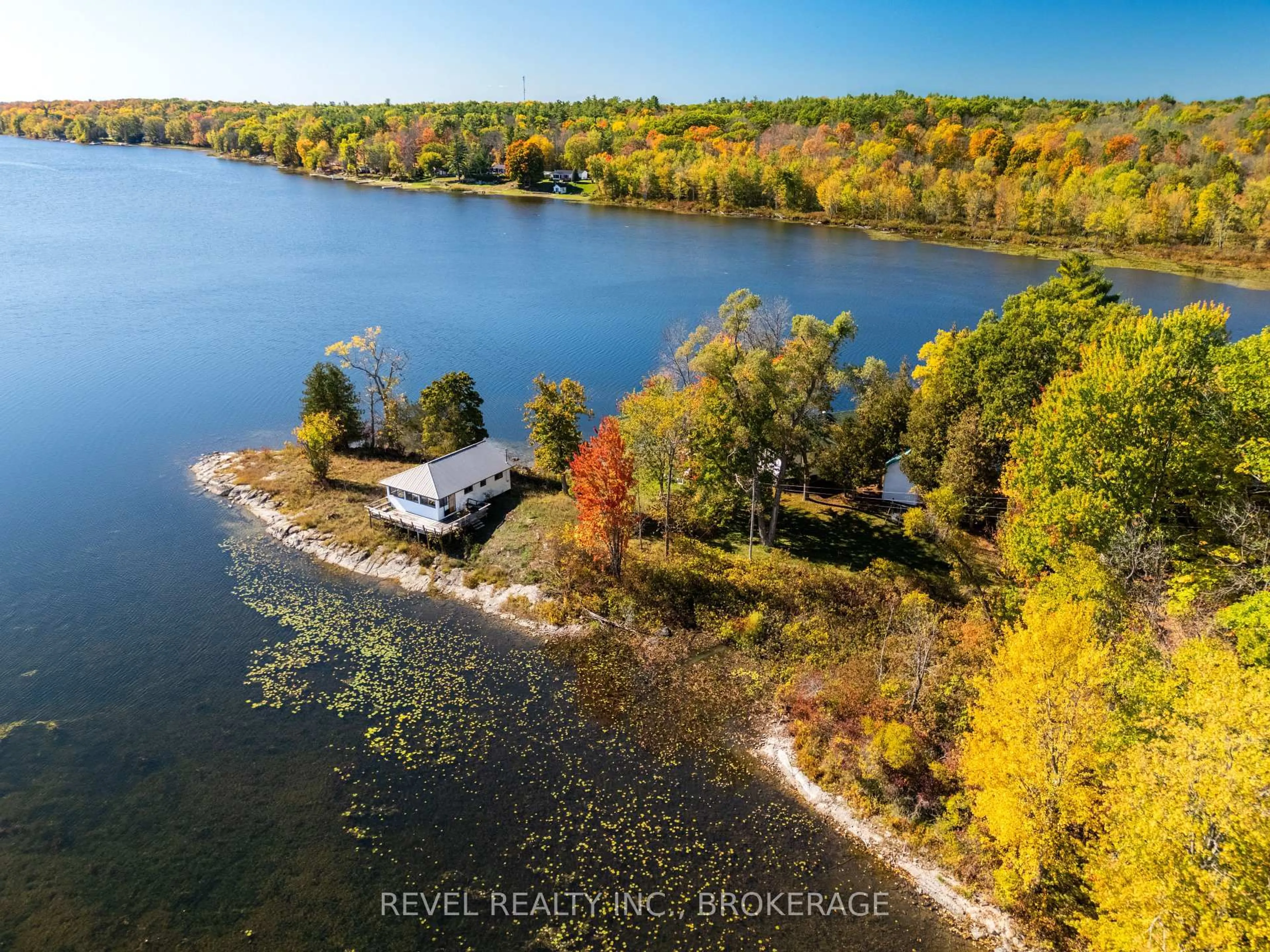 A pic from outside/outdoor area/front of a property/back of a property/a pic from drone, water/lake/river/ocean view for 1019A Kens Lane, Verona Ontario K0H 2W0