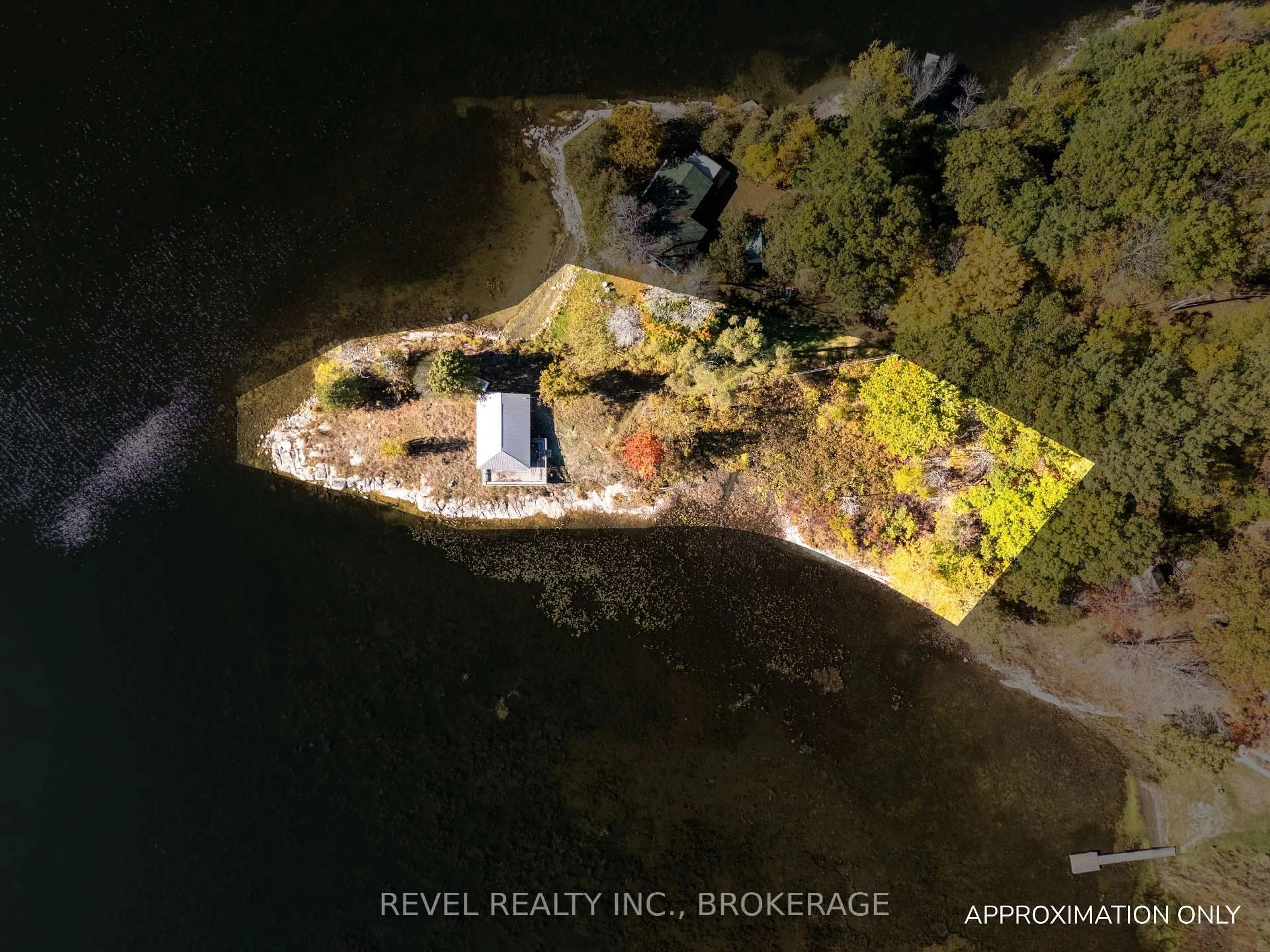 A pic from outside/outdoor area/front of a property/back of a property/a pic from drone, water/lake/river/ocean view for 1019A Kens Lane, Verona Ontario K0H 2W0