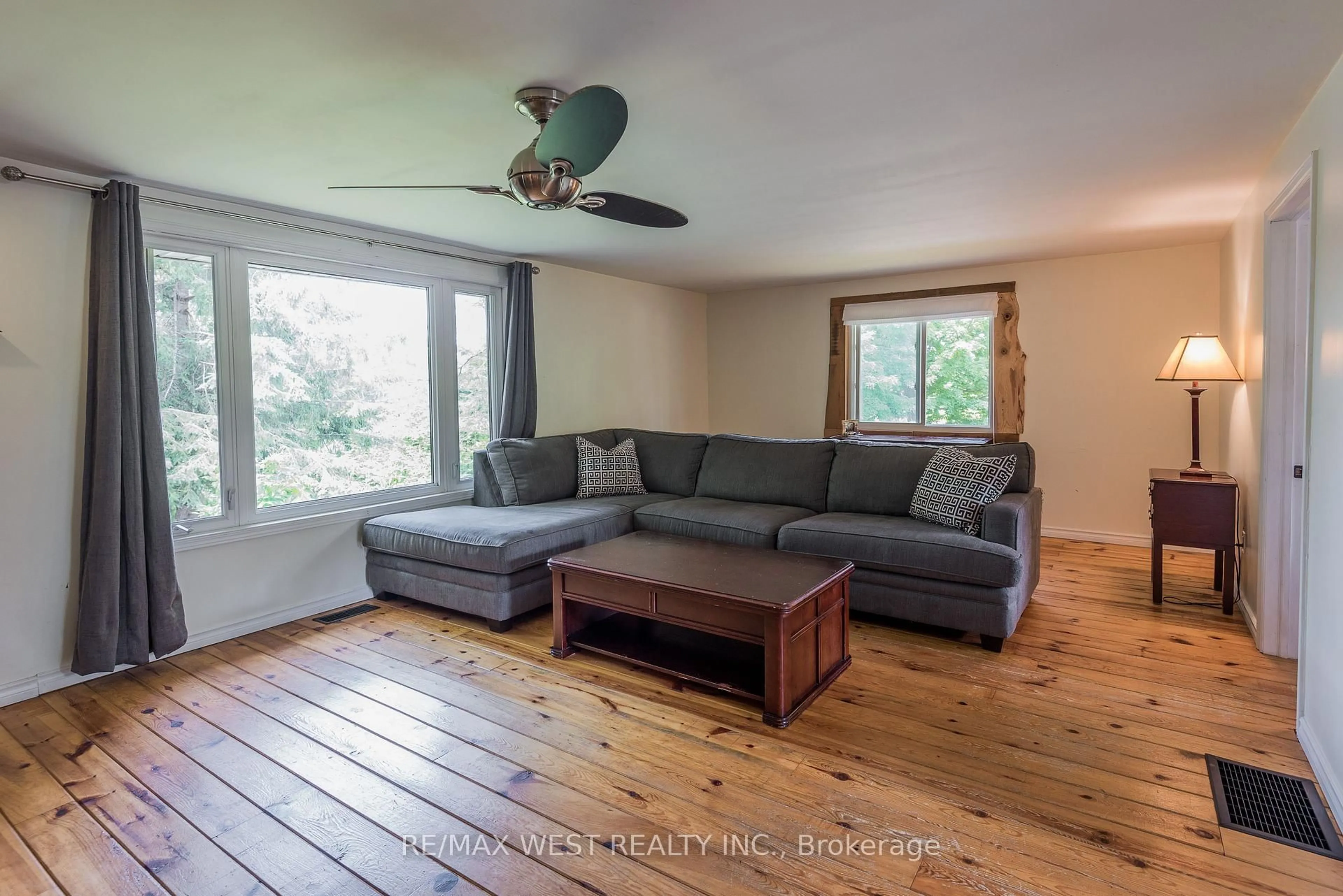 Living room with furniture, wood/laminate floor for 8 Robins Lane, Kawartha Lakes Ontario L0K 1W0