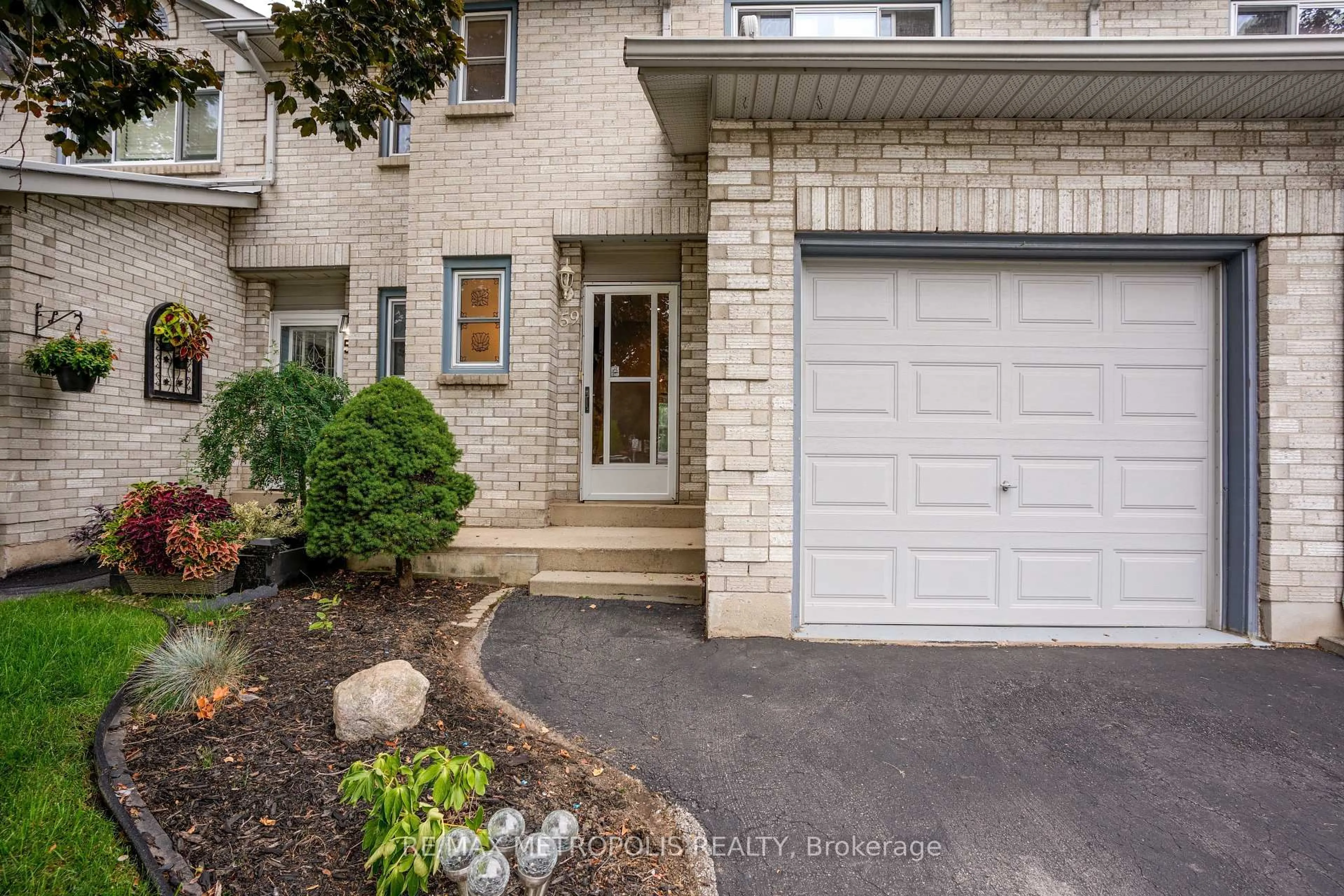 Home with brick exterior material, street for 2 Royalwood Crt #59, Hamilton Ontario L8E 4Z1