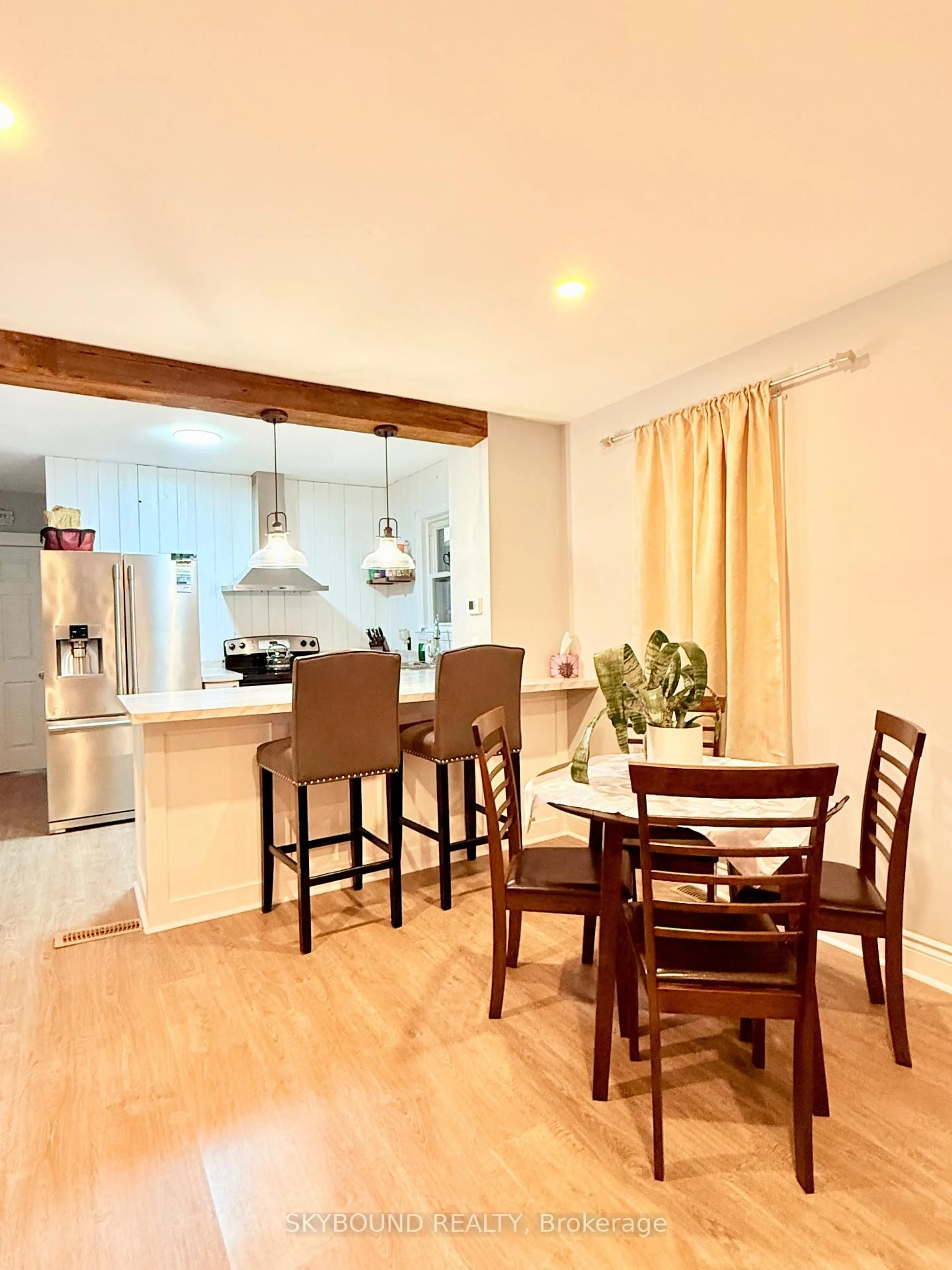 Open concept kitchen, wood/laminate floor for 1723 Langlois Ave, Windsor Ontario N8X 4M4