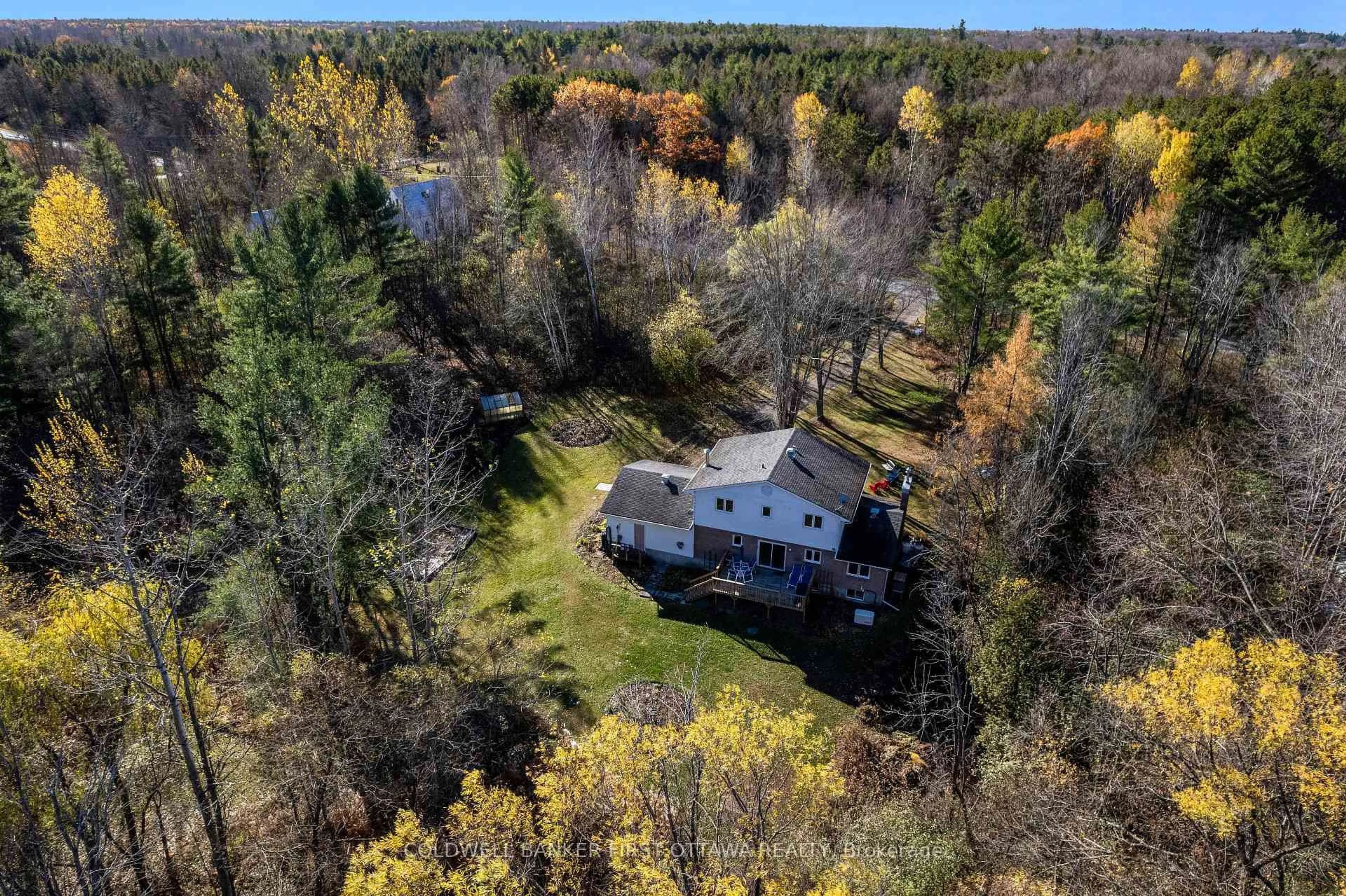 A pic from outside/outdoor area/front of a property/back of a property/a pic from drone, forest/trees view for 3900 Stonecrest Rd, Ottawa Ontario K0A 3M0