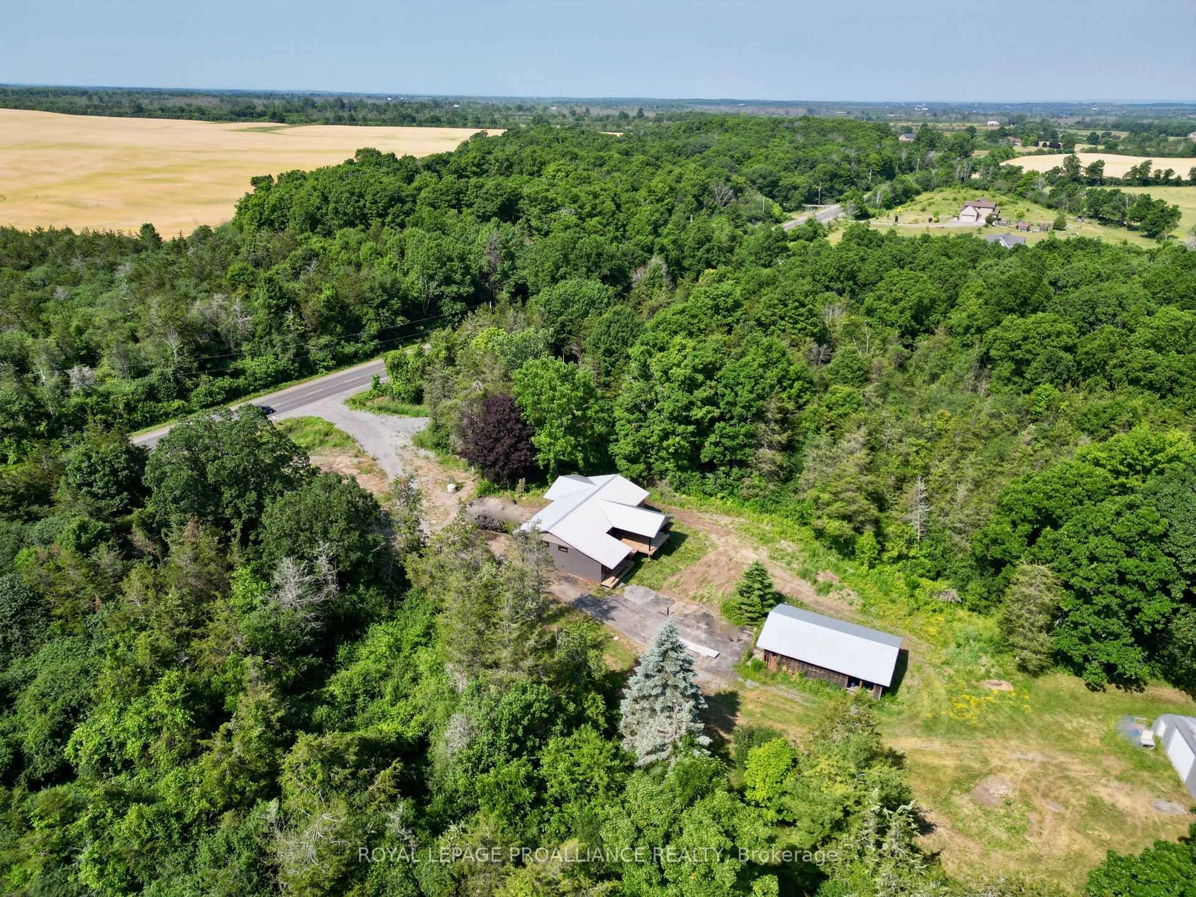 A pic from outside/outdoor area/front of a property/back of a property/a pic from drone, forest/trees view for 3628 County Road 1, Prince Edward County Ontario K0K 1G0