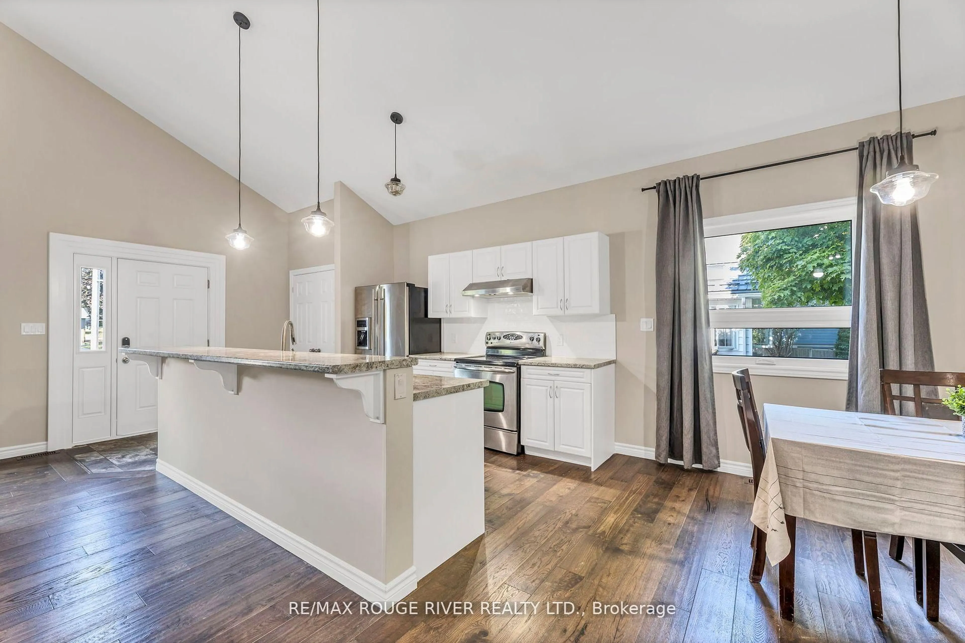 Open concept kitchen, wood/laminate floor for 100 Queen St, Kawartha Lakes Ontario K0M 1N0