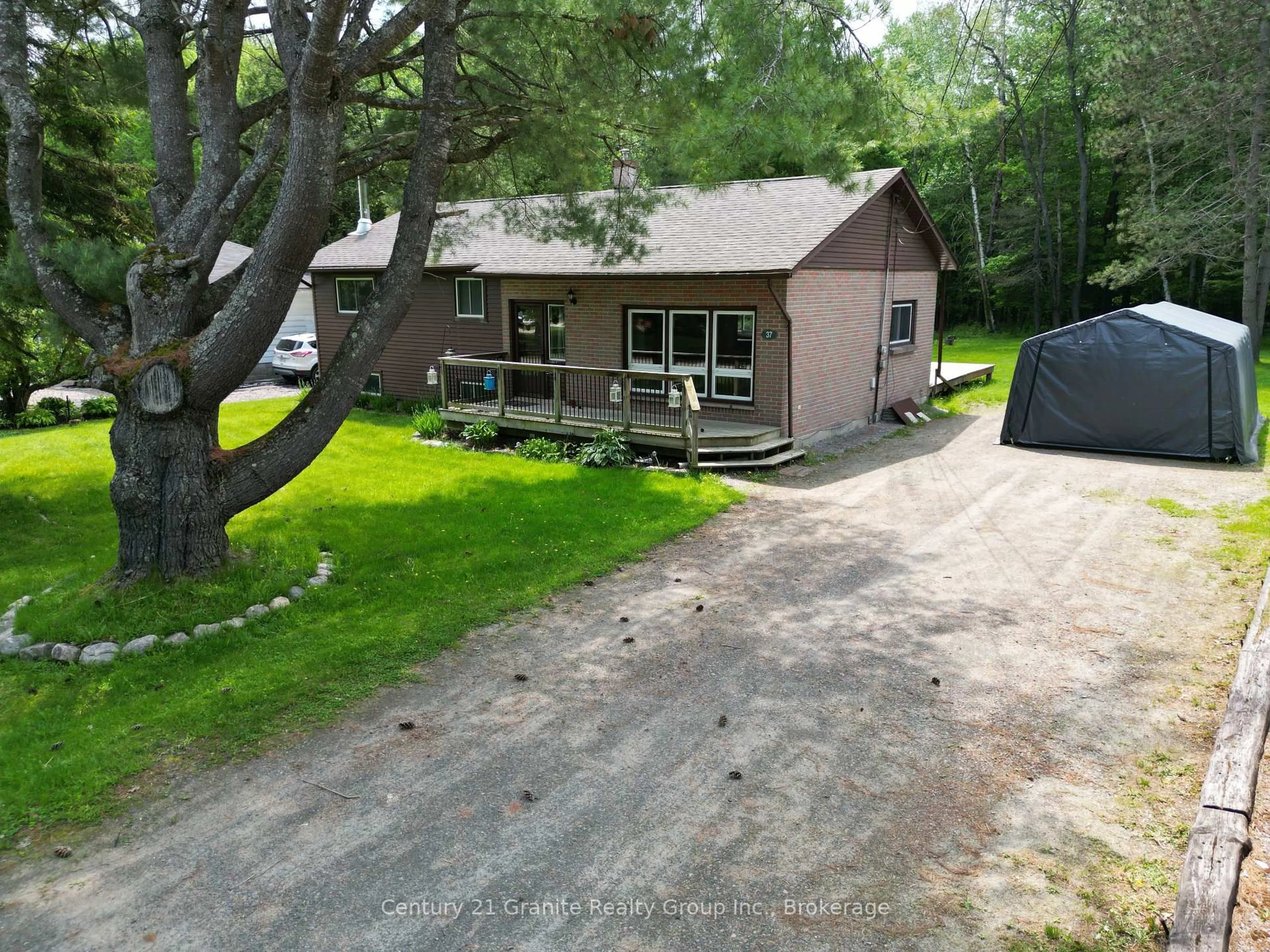 A pic from outside/outdoor area/front of a property/back of a property/a pic from drone, street for 37 Mckay St, Minden Hills Ontario K0M 2K0