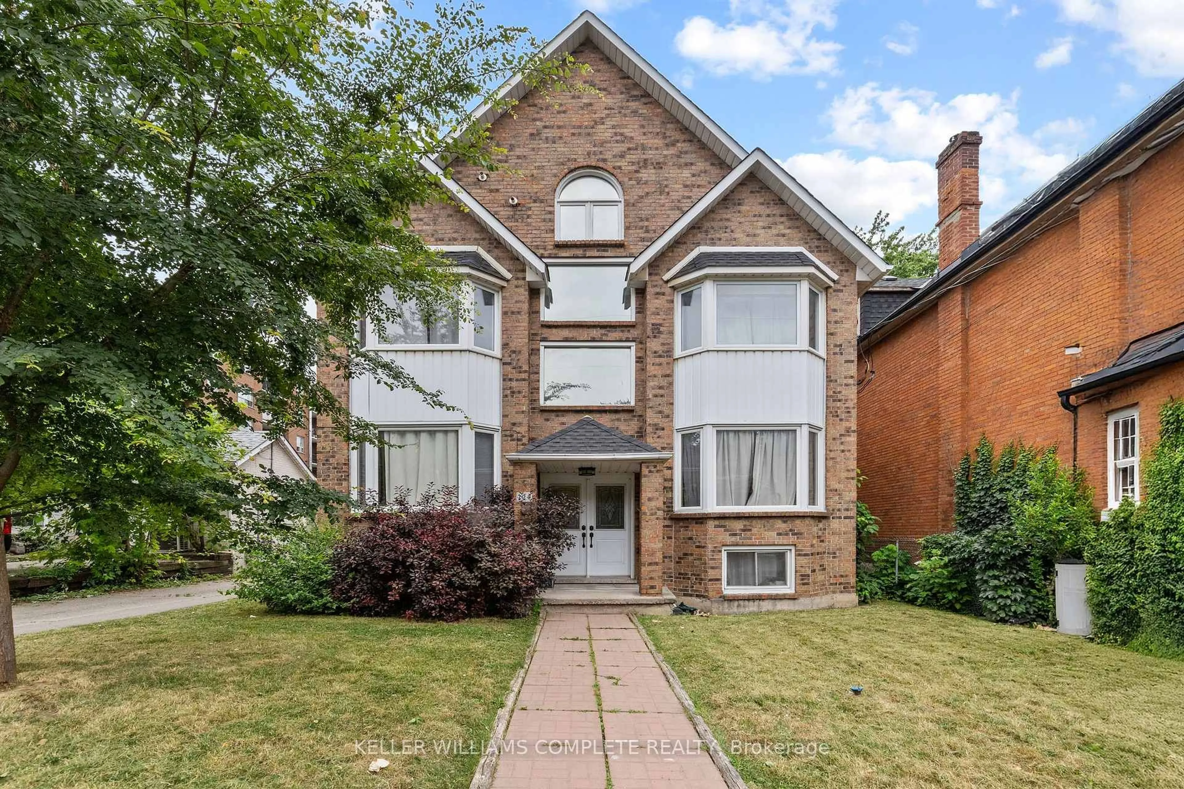 Home with brick exterior material, street for 220 Caroline St, Hamilton Ontario L8P 3L4