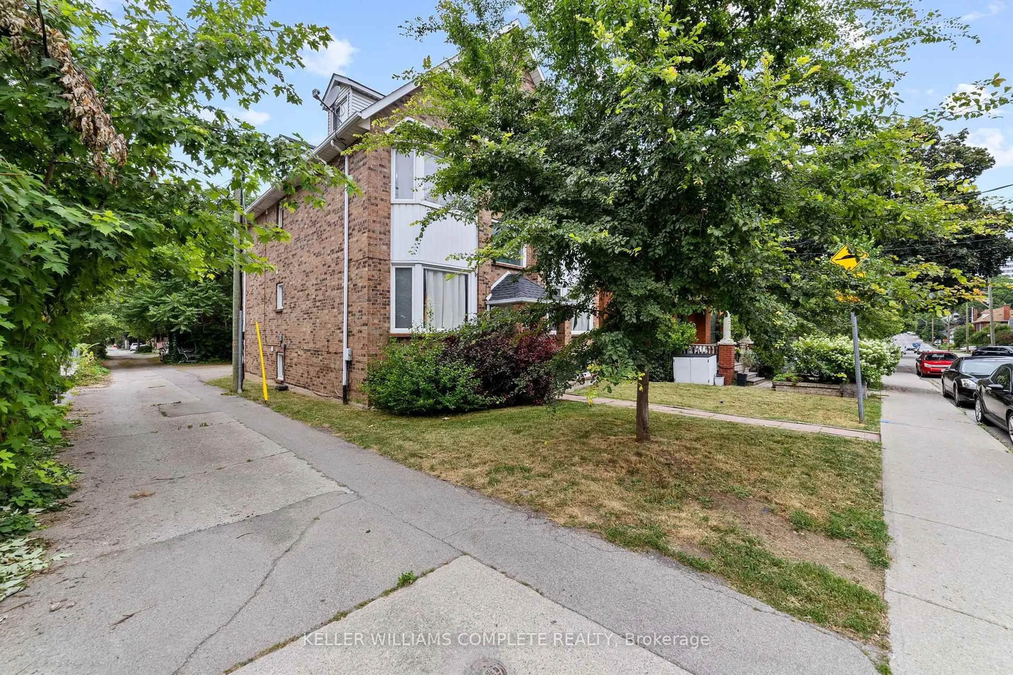 Home with brick exterior material, street for 220 Caroline St, Hamilton Ontario L8P 3L4
