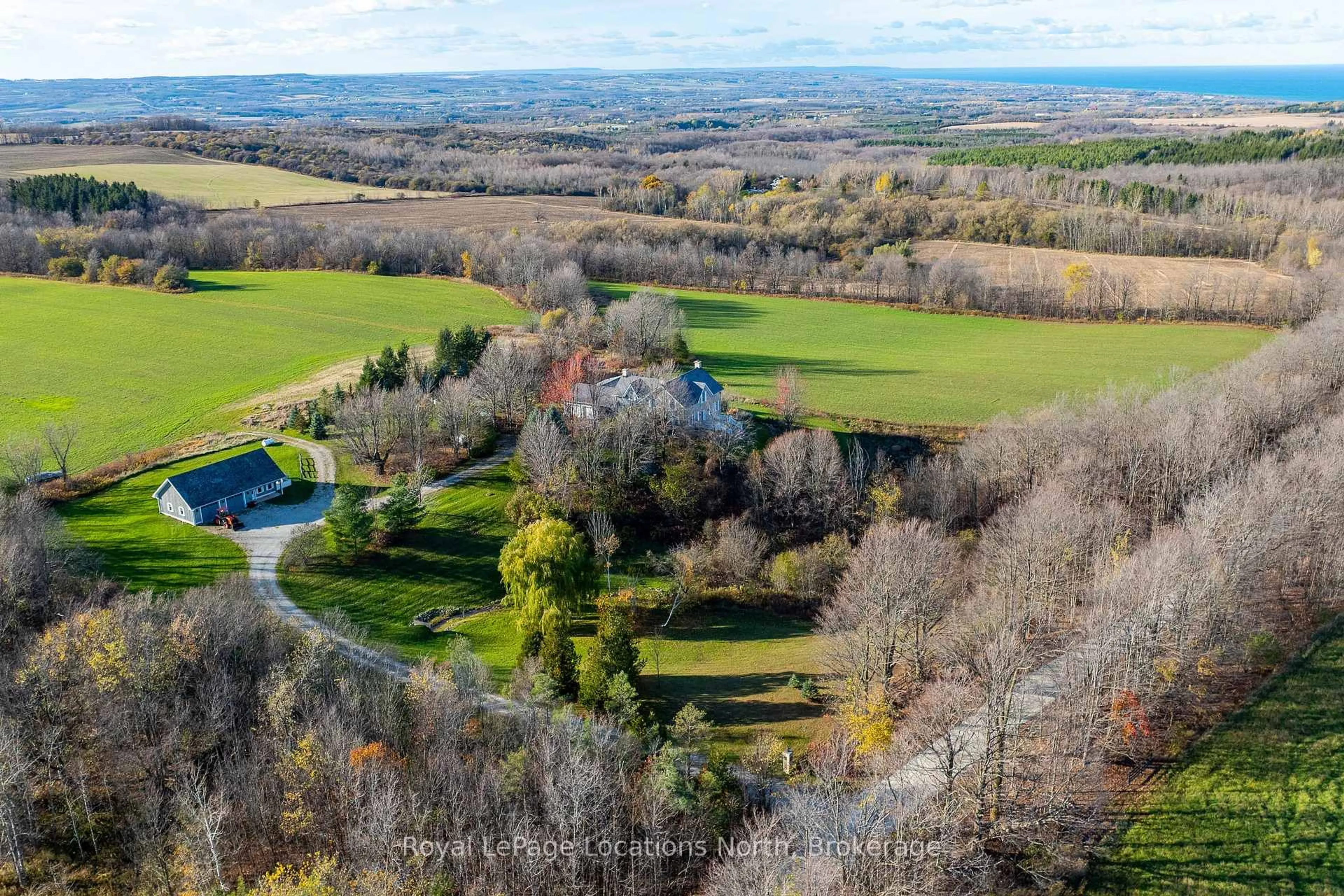 A pic from outside/outdoor area/front of a property/back of a property/a pic from drone, forest/trees view for 556036 6th Line, Blue Mountains Ontario N0H 1J0