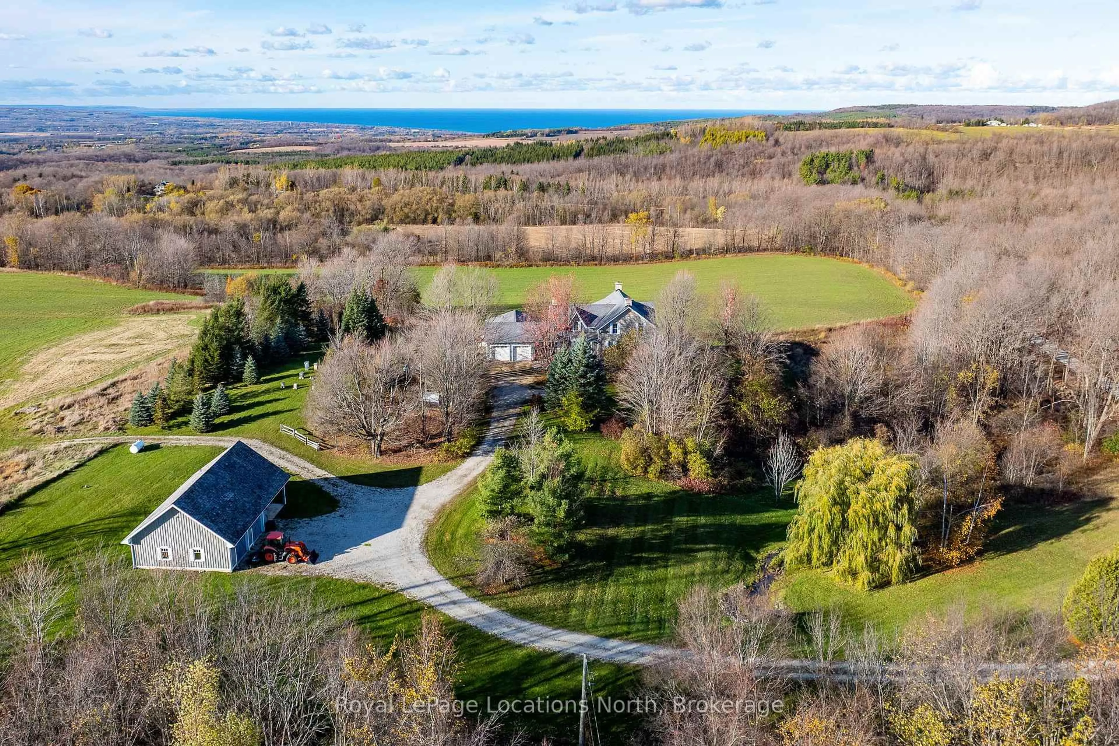 A pic from outside/outdoor area/front of a property/back of a property/a pic from drone, water/lake/river/ocean view for 556036 6th Line, Blue Mountains Ontario N0H 1J0