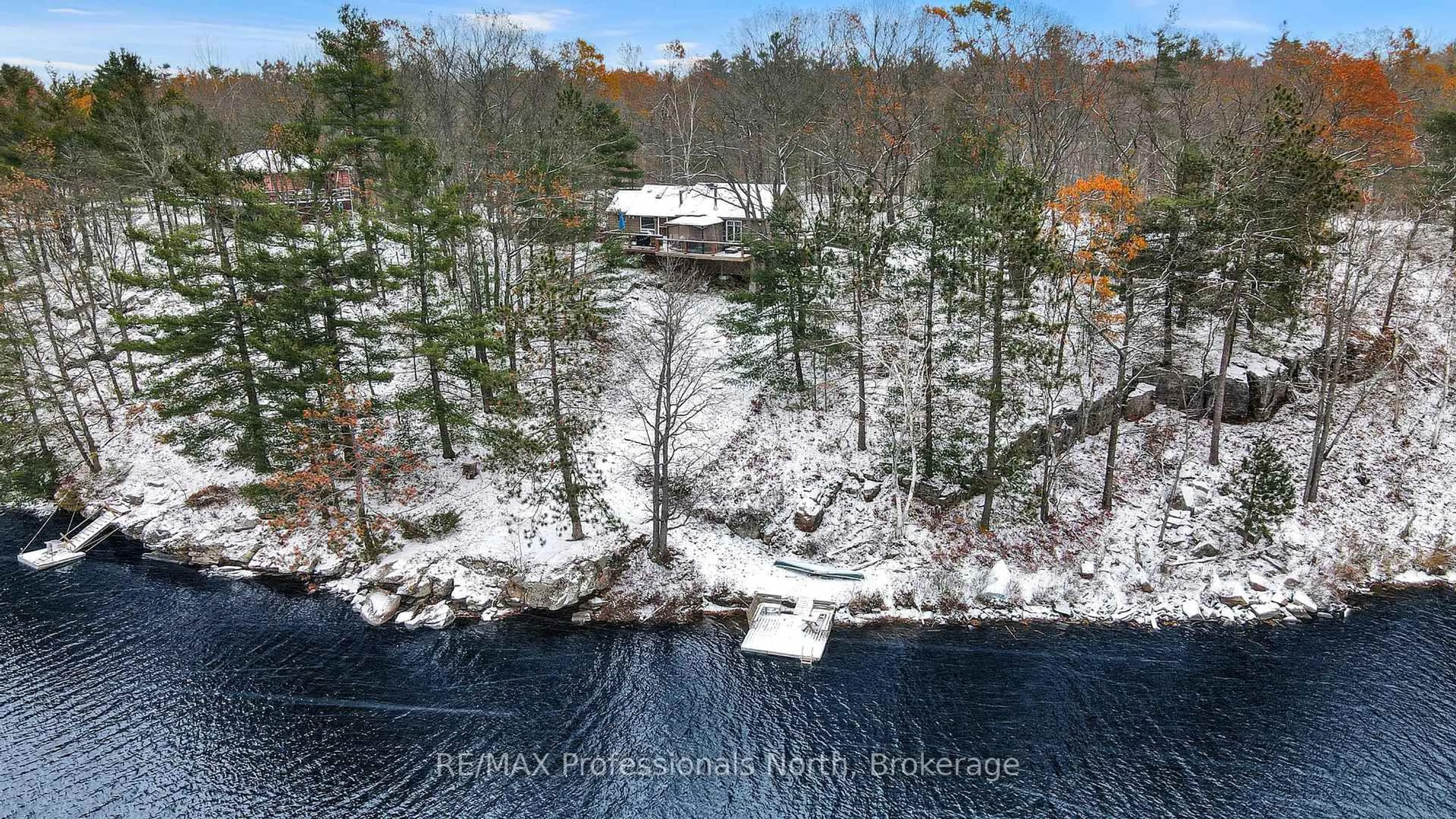 A pic from outside/outdoor area/front of a property/back of a property/a pic from drone, forest/trees view for 1012 Iroquois Lane, Minden Hills Ontario K0M 2K0