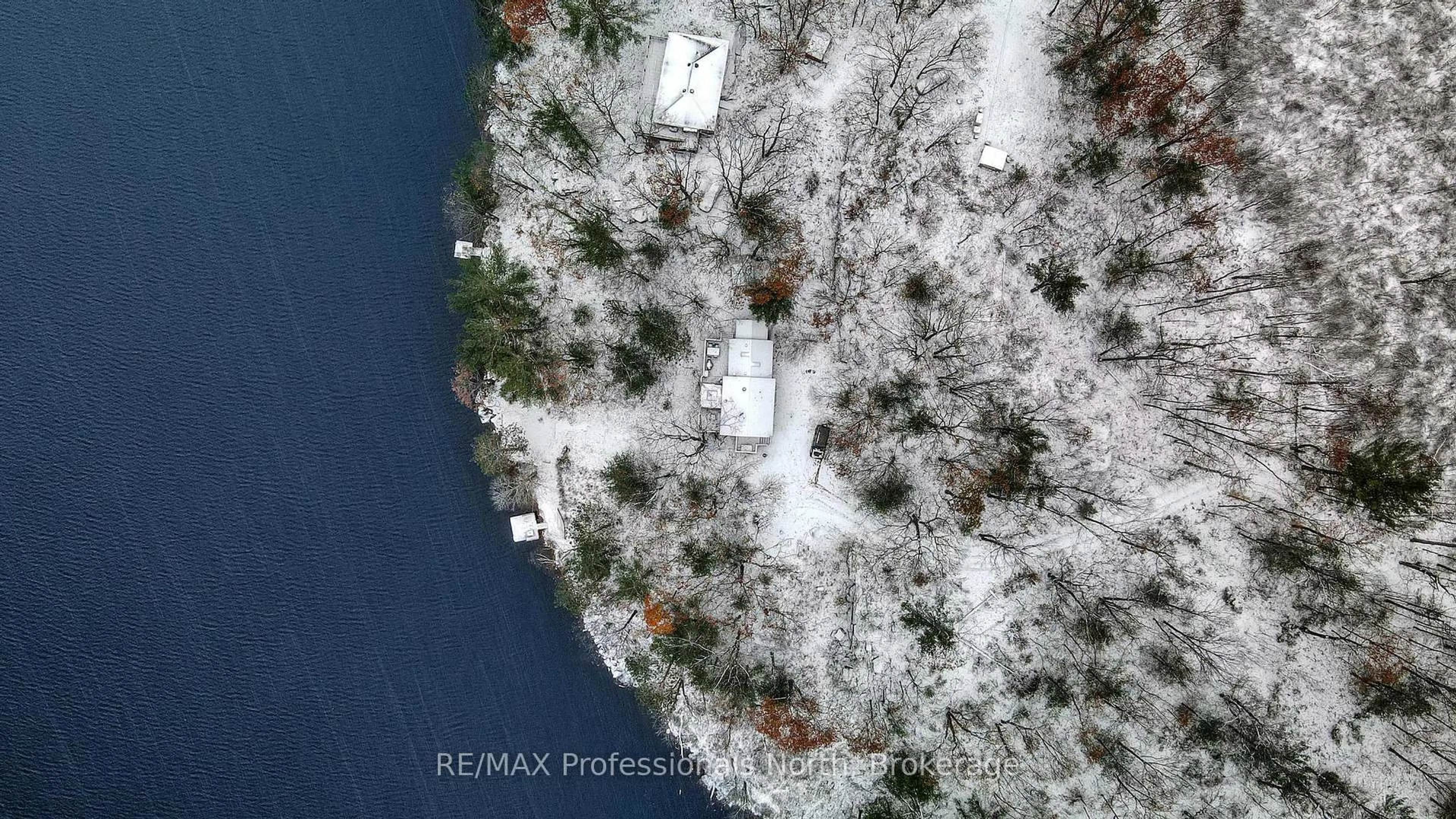 A pic from outside/outdoor area/front of a property/back of a property/a pic from drone, water/lake/river/ocean view for 1012 Iroquois Lane, Minden Hills Ontario K0M 2K0